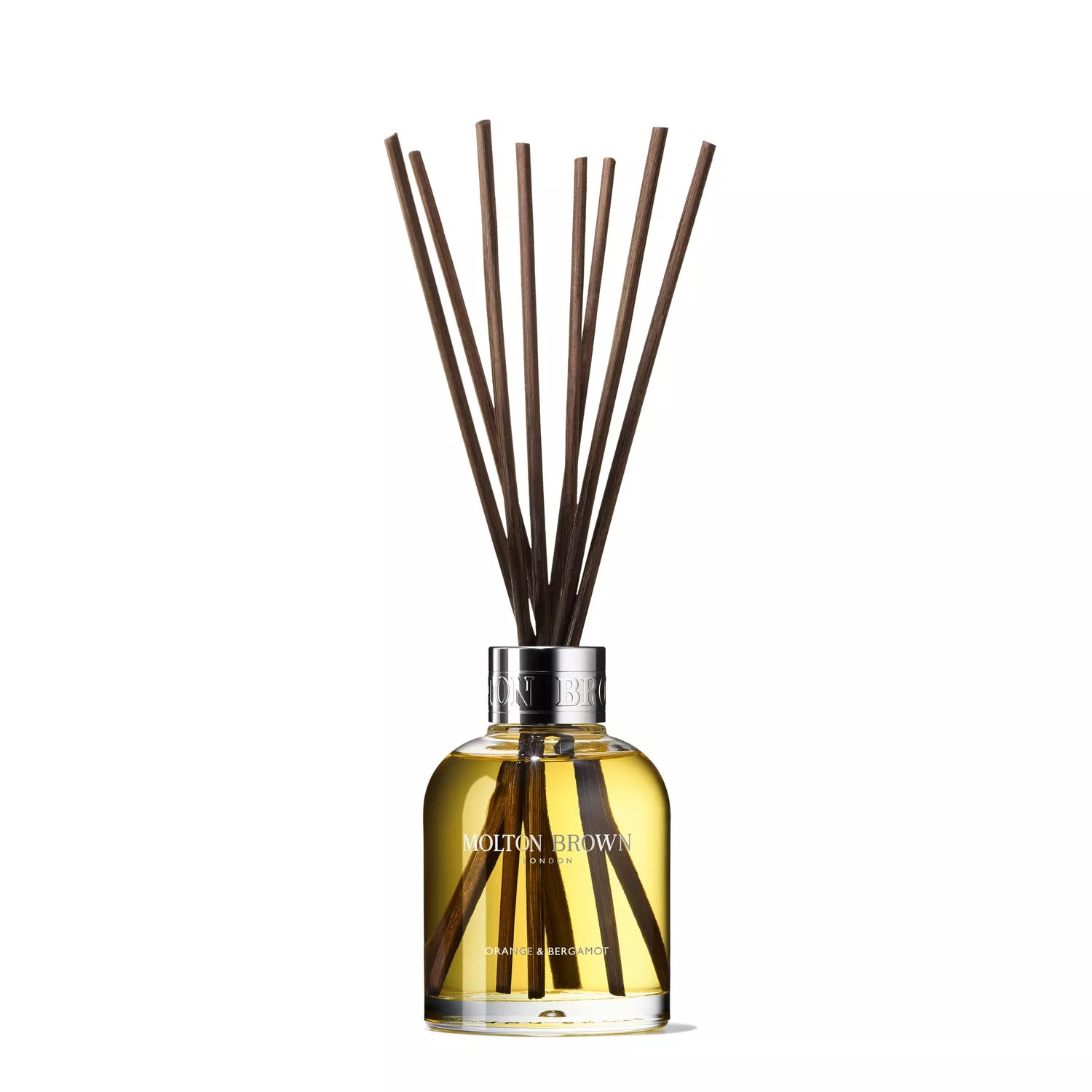 A glass bottle containing a yellowish liquid with bamboo reeds, perfect for diffusing the citrus home fragrance from MoltonBrown Cyprus. Its silver cap and brand lettering complement the elegant minimalist design, making it pop against the white background.