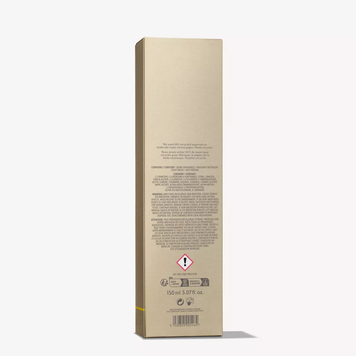 The image displays the back of a tall, rectangular, gold-colored box for a cosmetic product from MoltonBrown Cyprus labeled as Sample 3. The packaging features text in multiple languages, with a lingering trace of Molton Brown's citrus home fragrance. A warning symbol is noticeable near the bottom along with the volume specification indicating 150 ml or 5.07 fl oz.