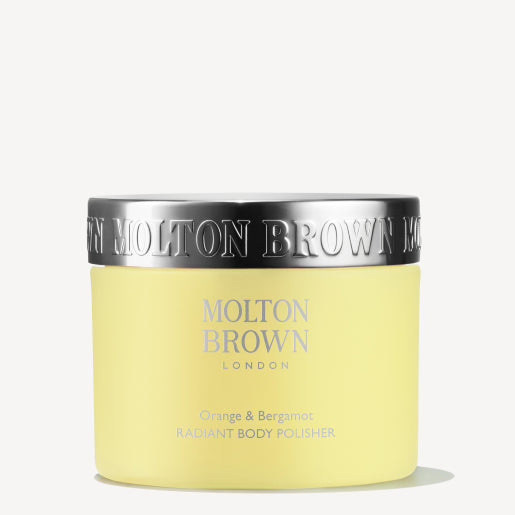 A jar of MoltonBrown Cyprus Orange & Bergamot Radiant Body Polisher 275g, enriched with citrus notes for a refreshing touch, is highlighted against a plain background and features a silver lid.