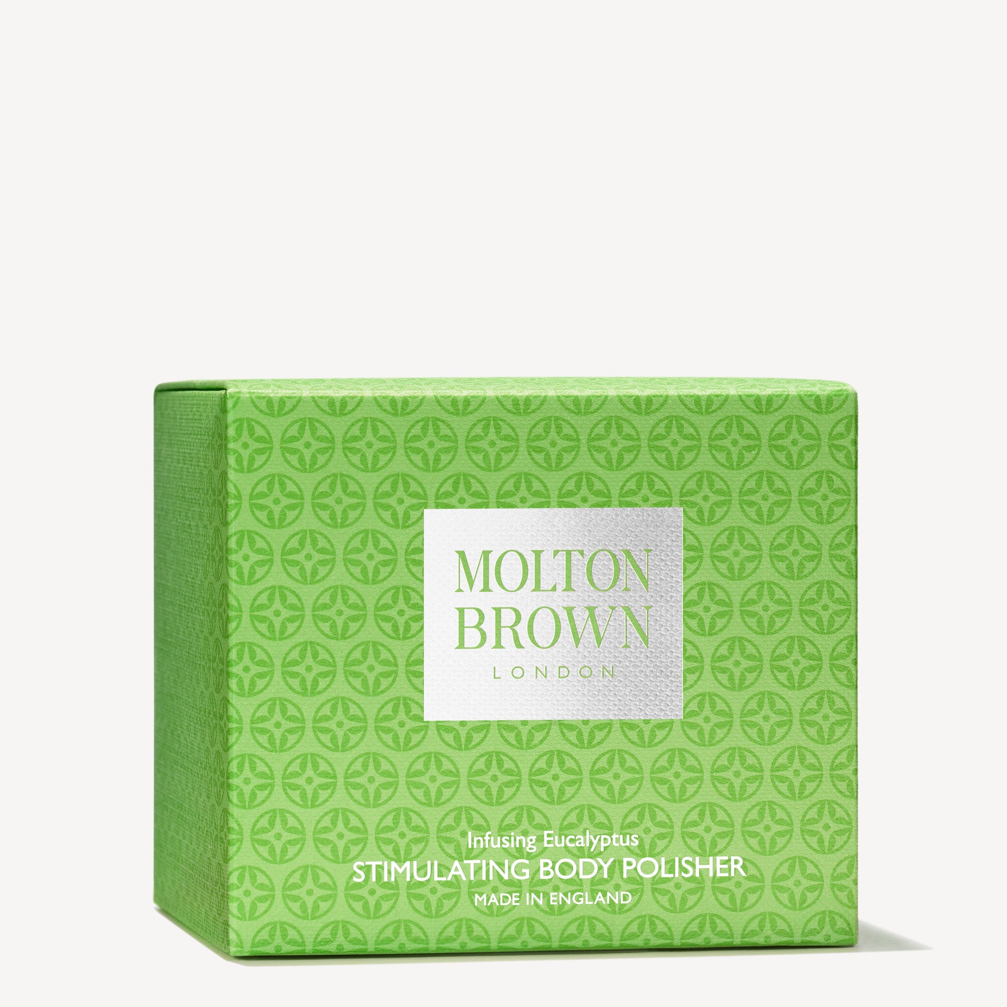 A green box with a geometric pattern, labeled MoltonBrown Cyprus and Infusing Eucalyptus Stimulating Body Polisher 275g, made in England, contains an exfoliating sugar body scrub that purifies and smoothes skin.