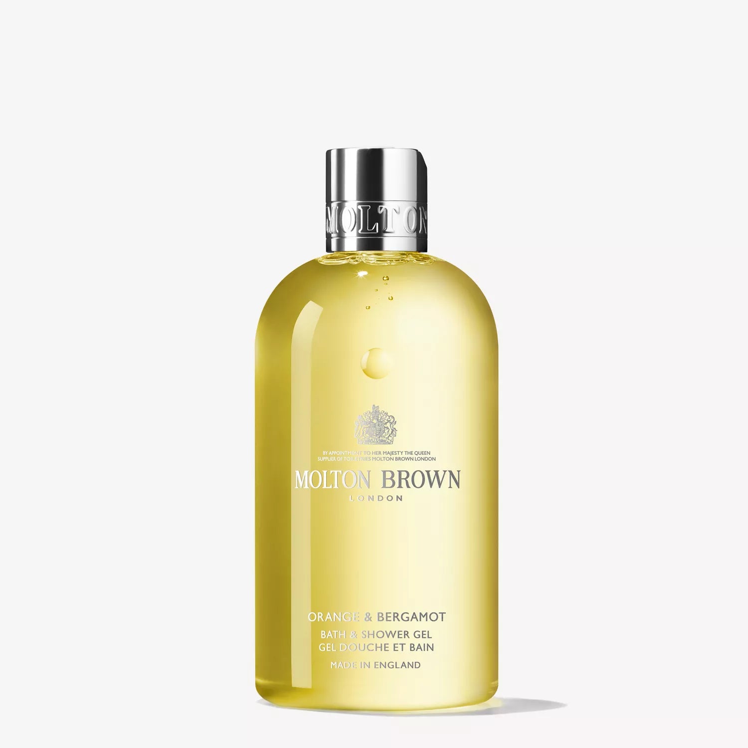A MoltonBrown Cyprus shower gel, Sample 2, is infused with fresh orange and bergamot notes. The clear bottle features a metallic cap and reveals the vibrant yellow liquid inside, along with text and a logo on the front.