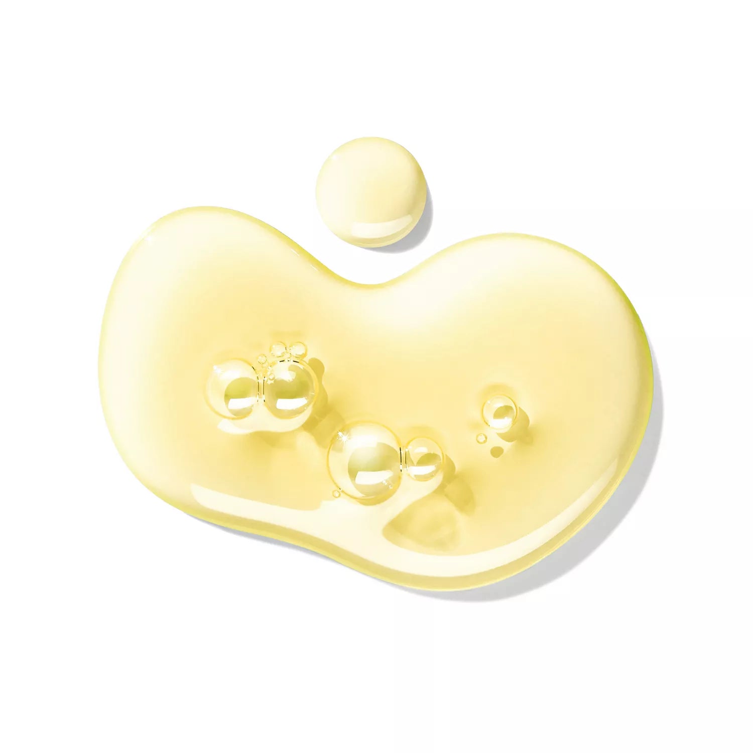 A sparkling, yellow droplet of Sample 2 by MoltonBrown Cyprus, evoking the essence of fresh oranges with several air bubbles within, is showcased against a white background.