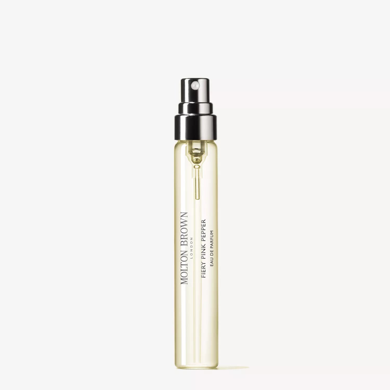 A sleek, cylindrical spray bottle of Sample 1 by MoltonBrown Cyprus showcases a transparent design that reveals a light yellow liquid imbued with spicy pink pepper notes. The bottle is equipped with a black spray nozzle and set against a white backdrop.