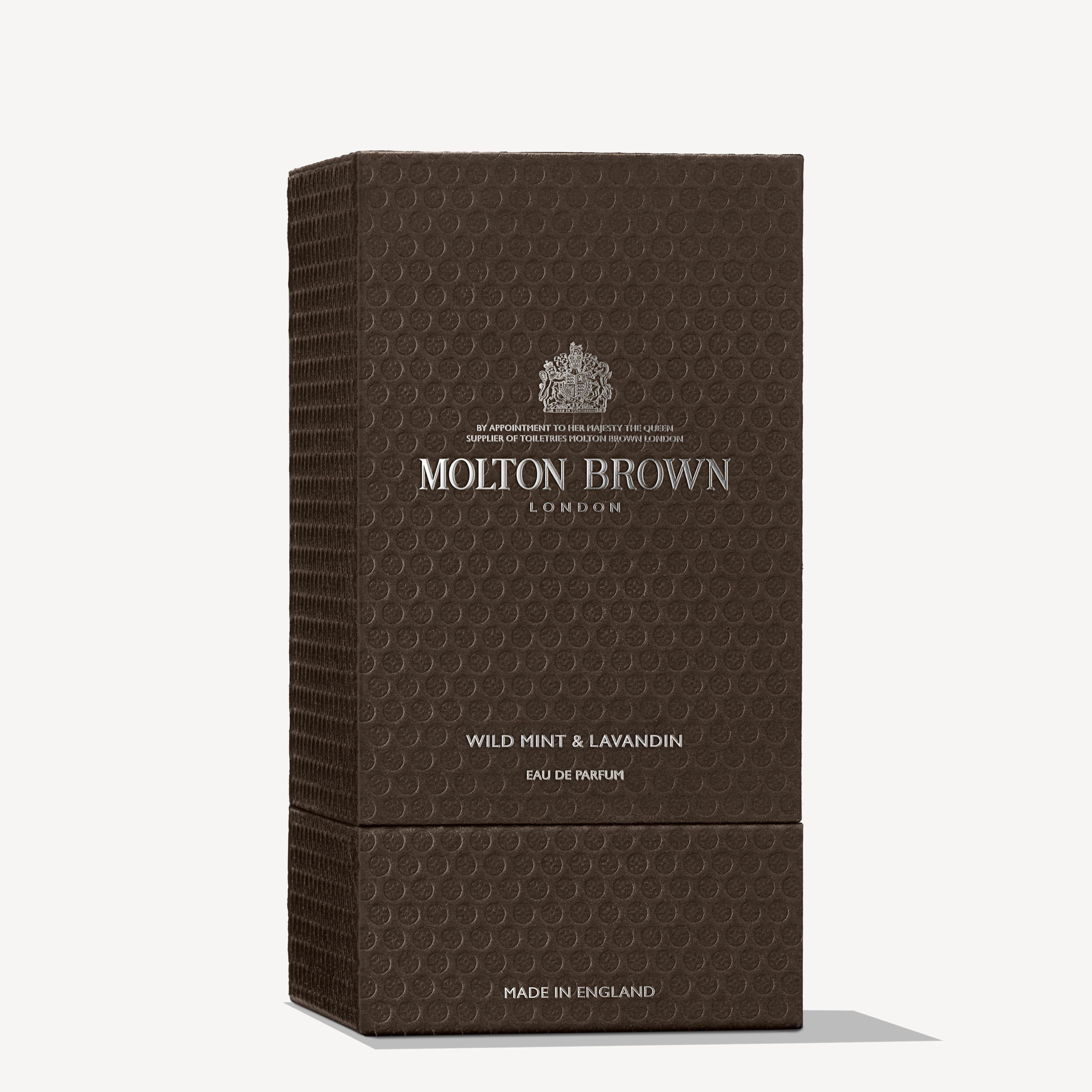 A box of MoltonBrown Cyprus Wild Mint & Lavandin Eau de Parfum 100ml in dark brown packaging, accented with lavender highlights, featuring a textured pattern and silver embossed text.