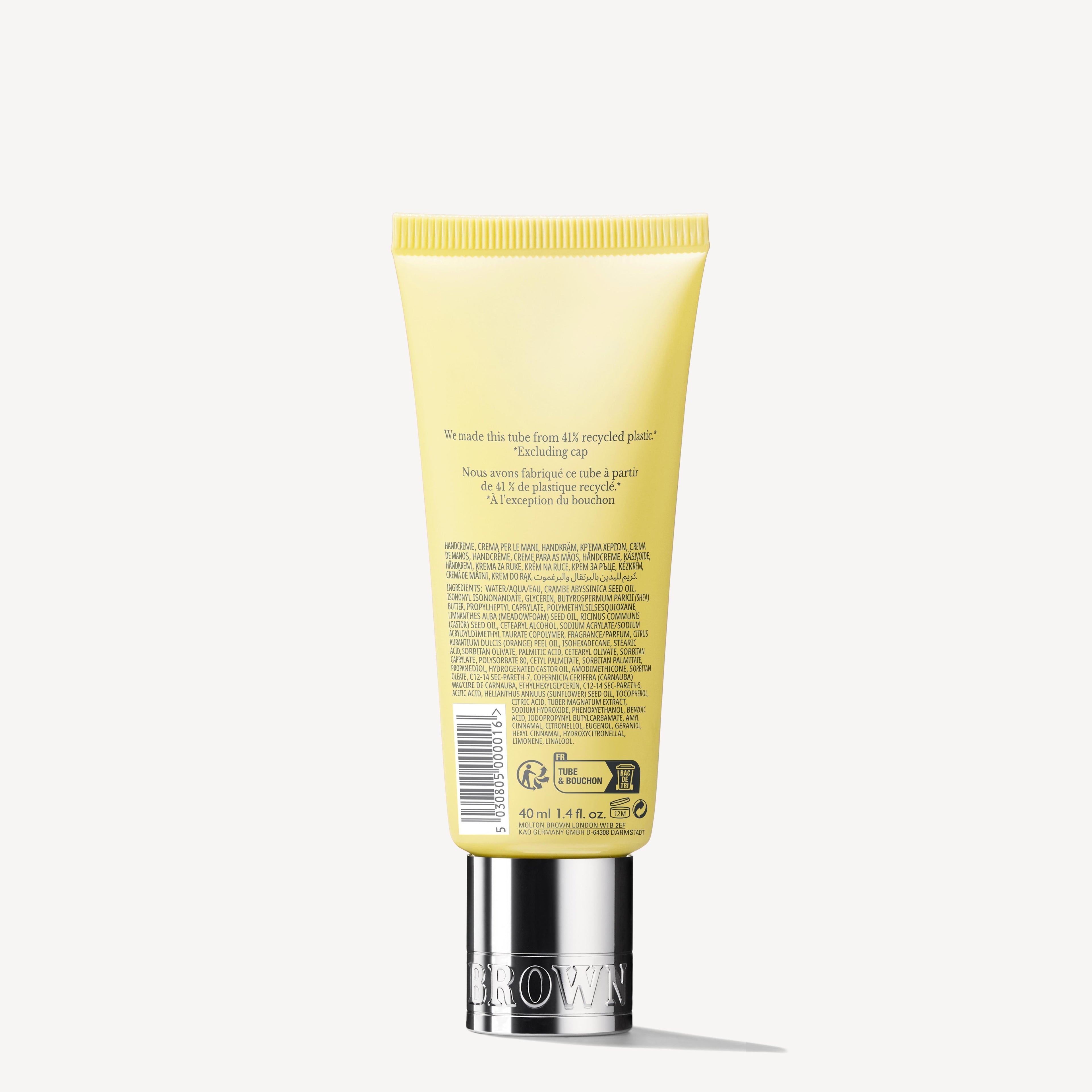 A tube of MoltonBrown Cyprus Orange & Bergamot Hand Cream, featuring a striking yellow design with a silver cap and text emphasizing its packaging made from 30% recycled plastic. This hand cream is infused with refreshing notes of mandarin and neroli, elegantly displayed upright against a light background.