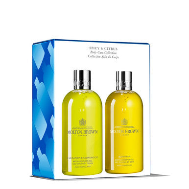 Image of a MoltonBrown Cyprus gift set showcasing two bottles of body wash, labeled Mandarin & Cinnamon and Gingerlily. The packaging features blue accents with "Spicy & Citrus Body Care Collection" written on the box, suggesting exotic cardamom undertones that enhance its allure.