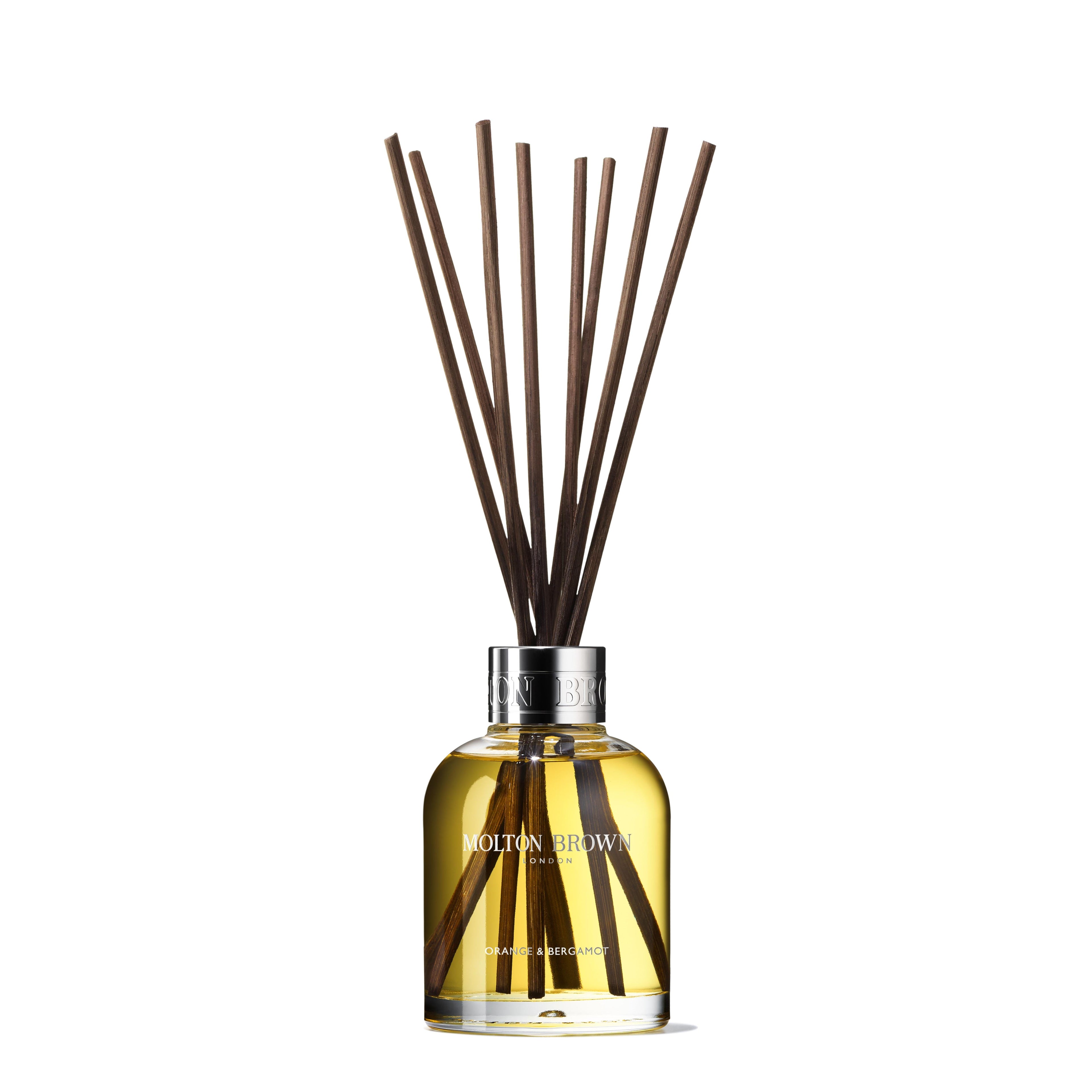 A MoltonBrown Cyprus diffuser bottle filled with yellow liquid is topped with several long, thin reeds. The Orange & Bergamot Aroma Reeds Refill 150ml features the brand's logo and fragrance name. This home fragrance is perfect for any space, using Aroma Reeds to spread its refreshing Sevillian orange citrus scent in a splayed formation.