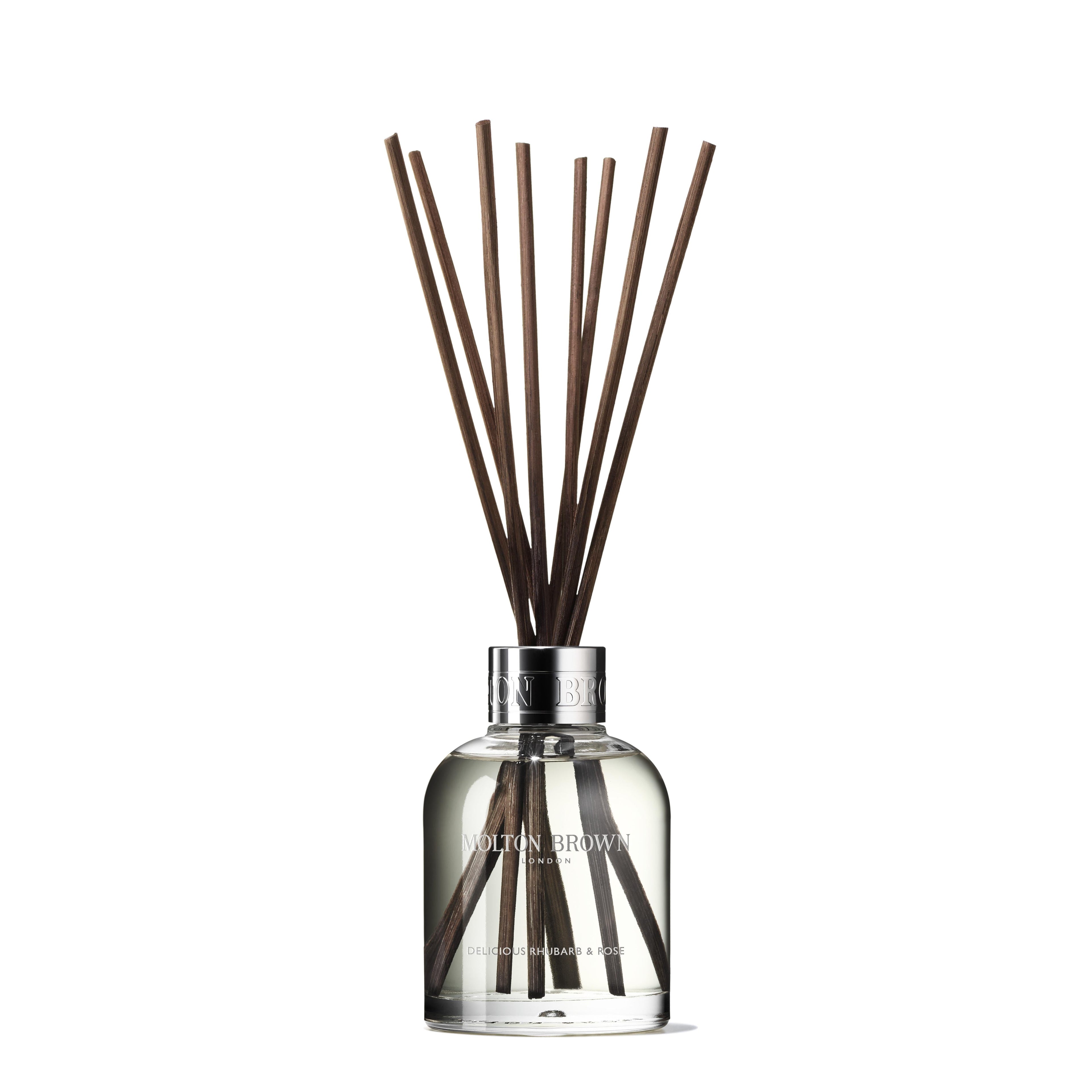 A glass diffuser bottle with brown reed sticks extending from the top, filled with a clear fragrant liquid infused with hints of vanilla. The label reads MoltonBrown Cyprus Delicious Rhubarb & Rose Aroma Reeds Refill 150ml. The bottle is displayed against a plain white background.