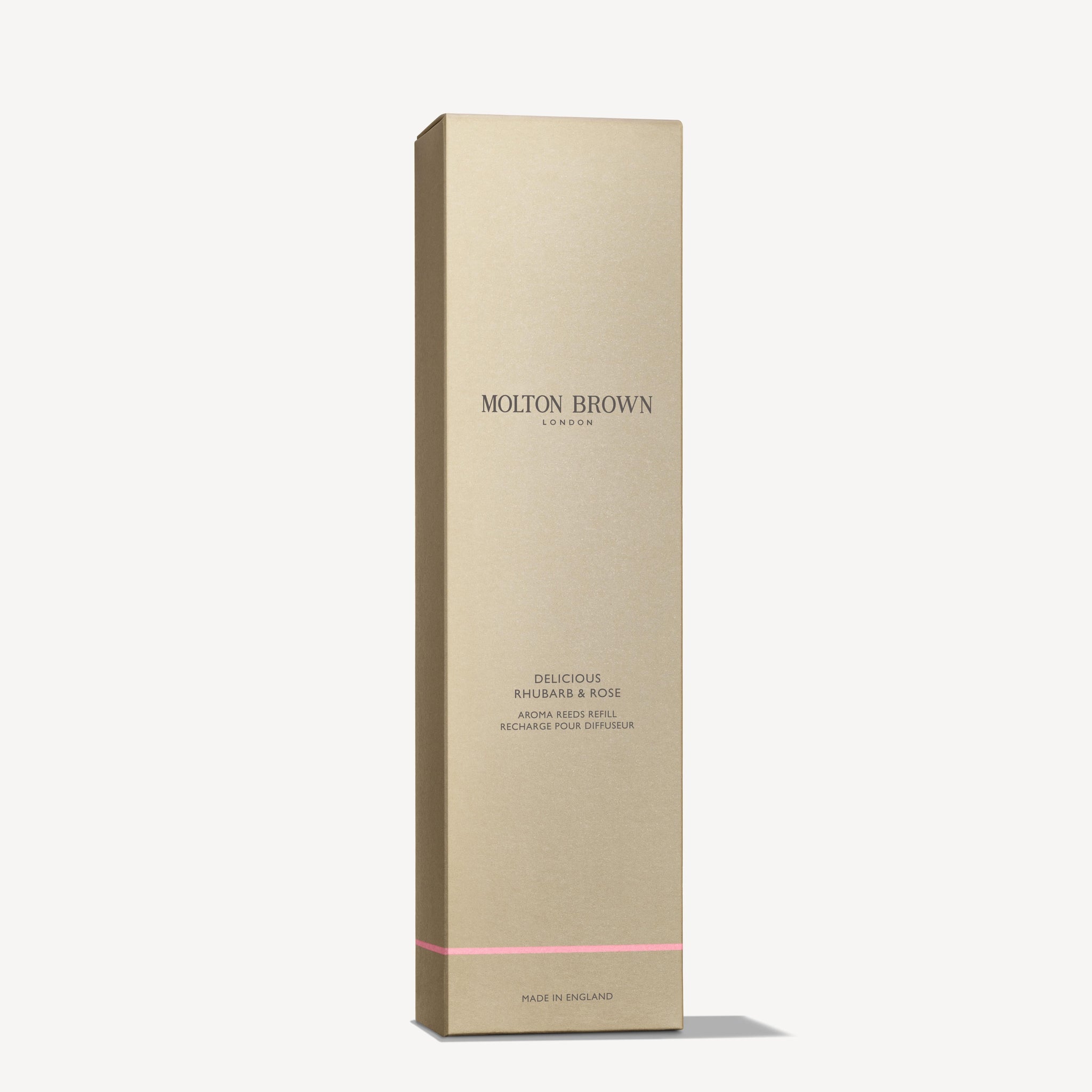 A slim, rectangular gold box featuring MoltonBrown Cyprus prominently in the center. Below, it states Delicious Rhubarb & Rose Aroma Reeds Refill 150ml. A delicate touch of grapefruit essence complements the pale pink line accent at the bottom. The box is positioned upright against a light background.