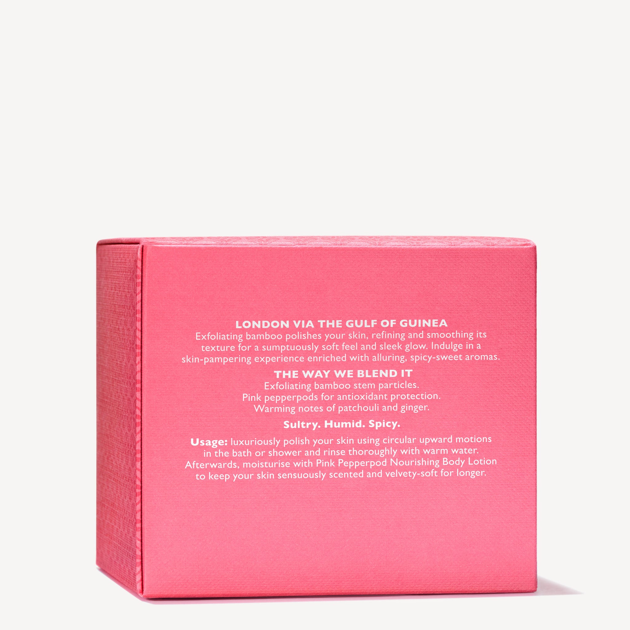 A pink box with white text presents the Fiery Pink Pepper Pampering Body Polisher by MoltonBrown Cyprus, a body scrub designed to improve skin texture. It features exfoliating bamboo and pink pepperpods, making it ideal for use in the bath or shower. The fragrance is sultry, humid, and spicy.