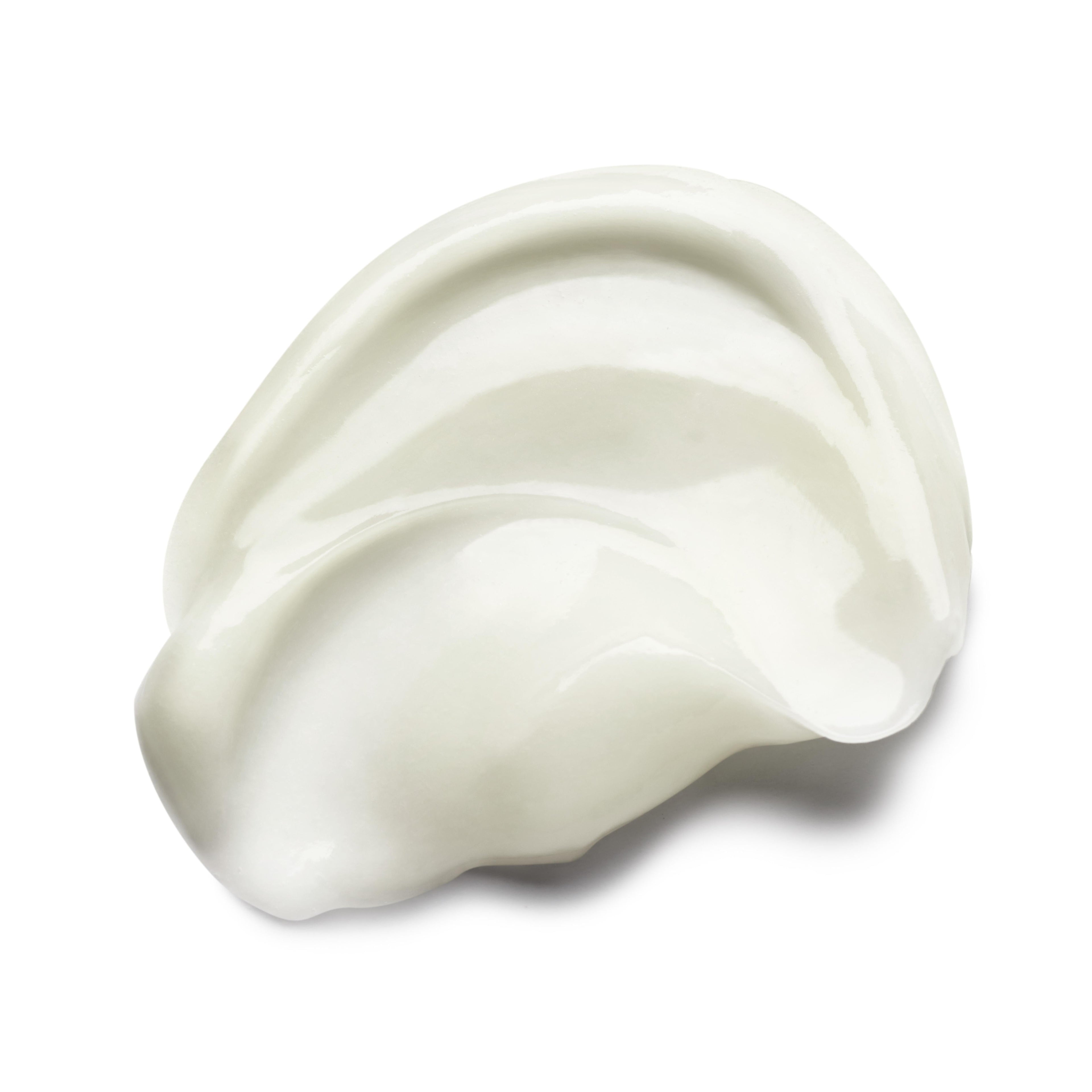 Close-up of a smooth, glossy white creamy substance swirled in soft, layered curves against a plain, white background. Its texture, reminiscent of MoltonBrown Cyprus's Purifying Conditioner With Indian Cress 300ml, suggests it could be a nourishing hair care product.