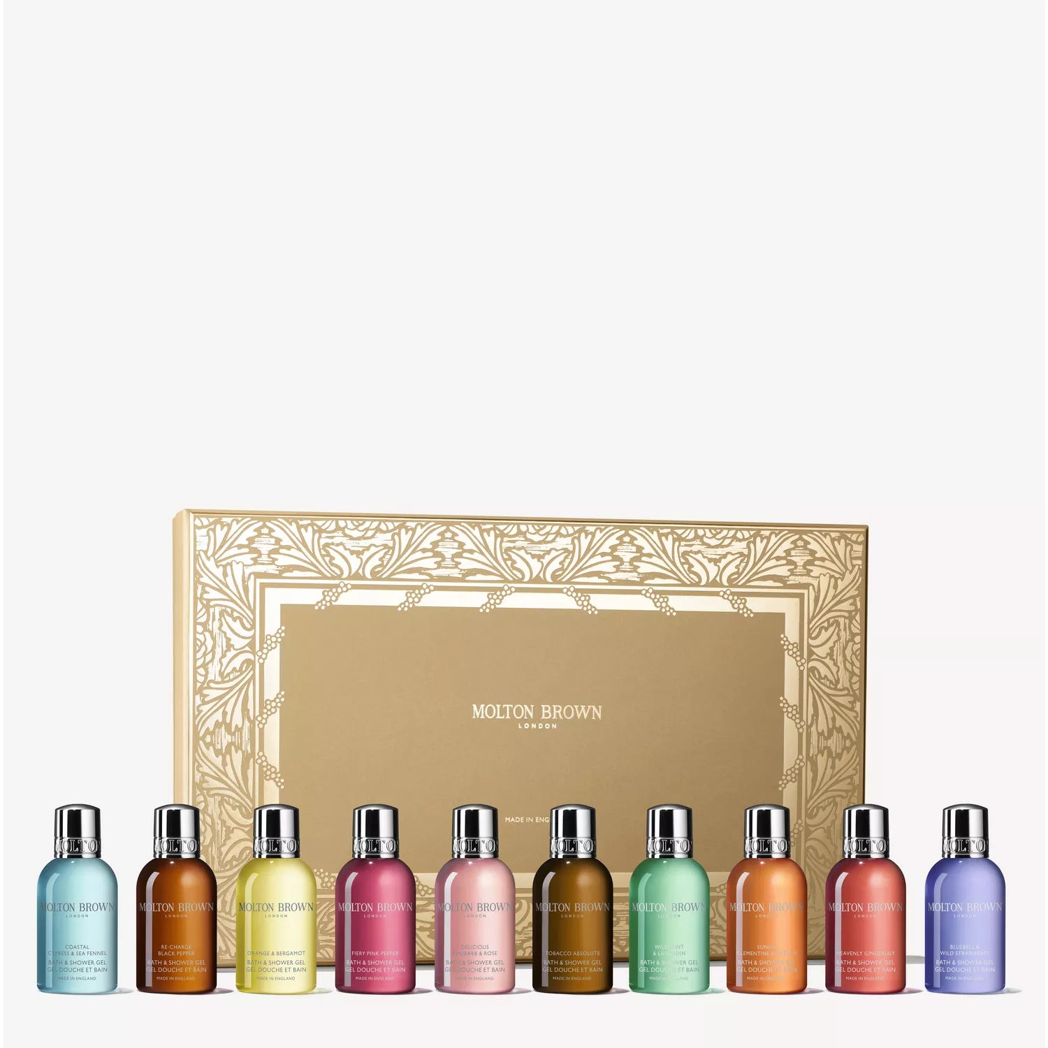 A MoltonBrown Cyprus Stocking Filler Gift Set features a gold gift box behind eleven small, colorful bath & shower gel bottles with silver caps and vibrant liquids—a luxurious fragrance treat for any occasion.
