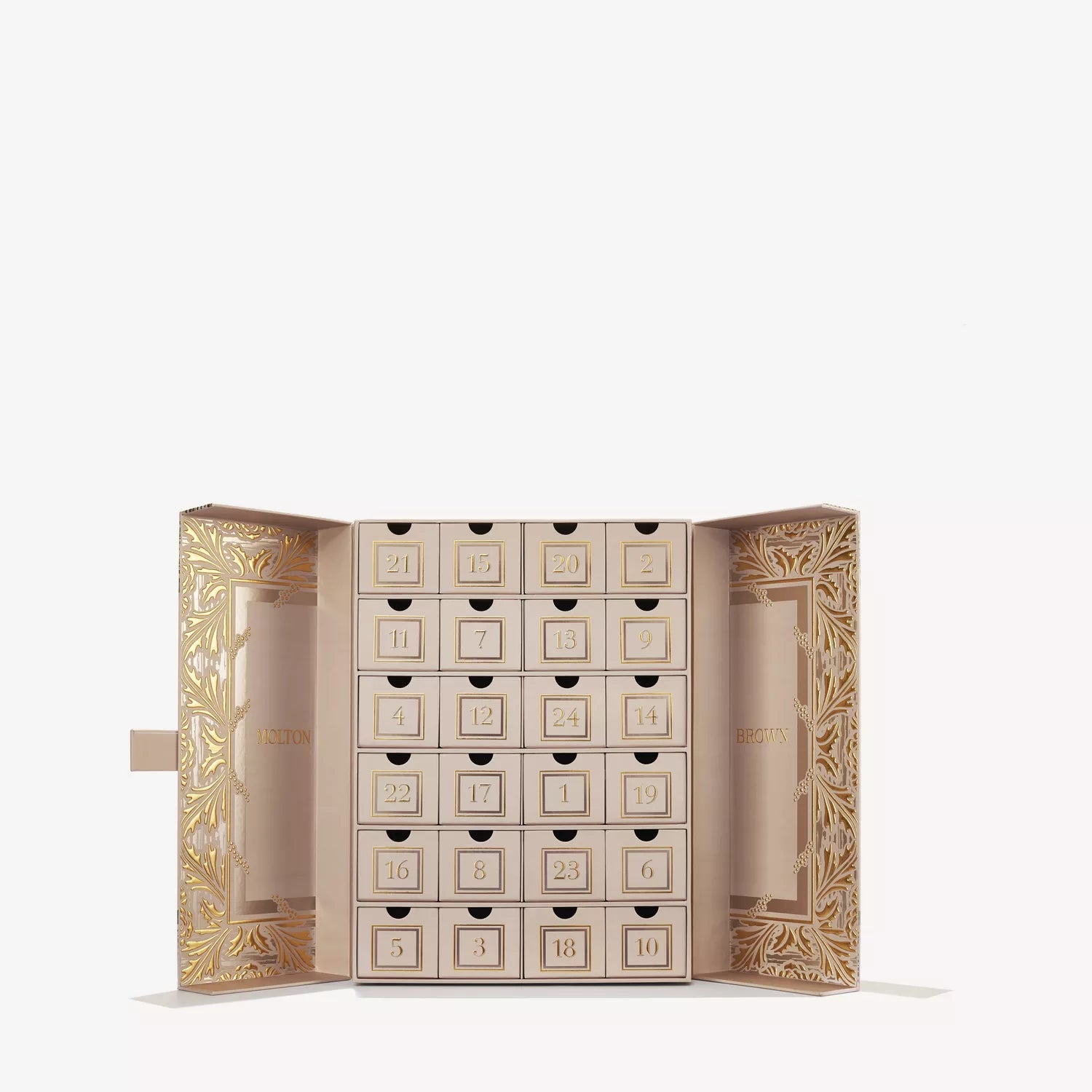 The MoltonBrown Cyprus Advent Calendar features a beige and gold box with 25 numbered drawers, each filled with scented delights, all presented in an ornate case decorated with elegant golden patterns.