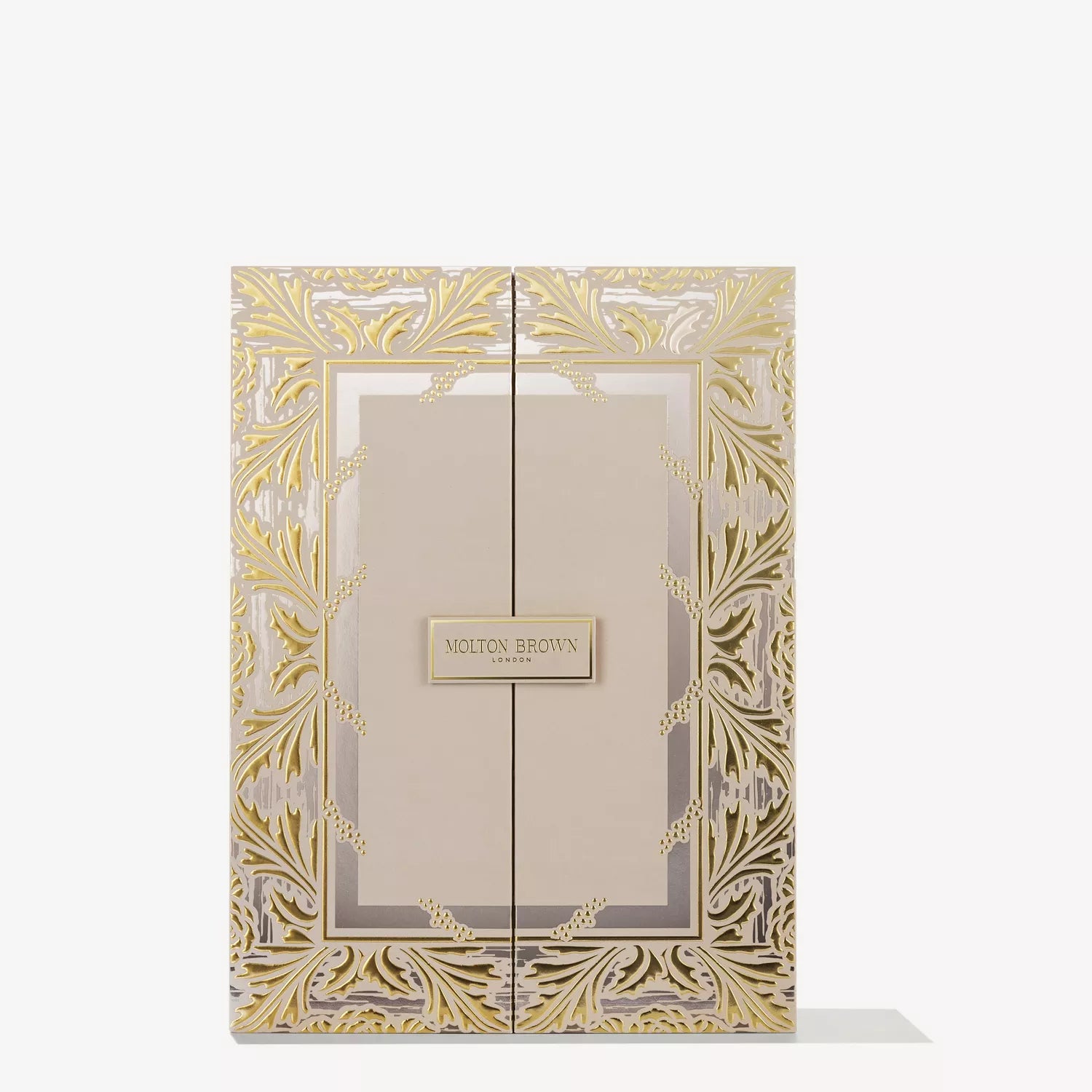 A luxurious MoltonBrown Cyprus Advent Calendar, featuring intricate gold floral patterns on beige with a central label and double doors, photographed on a white background—a true collection of scented treasures.
