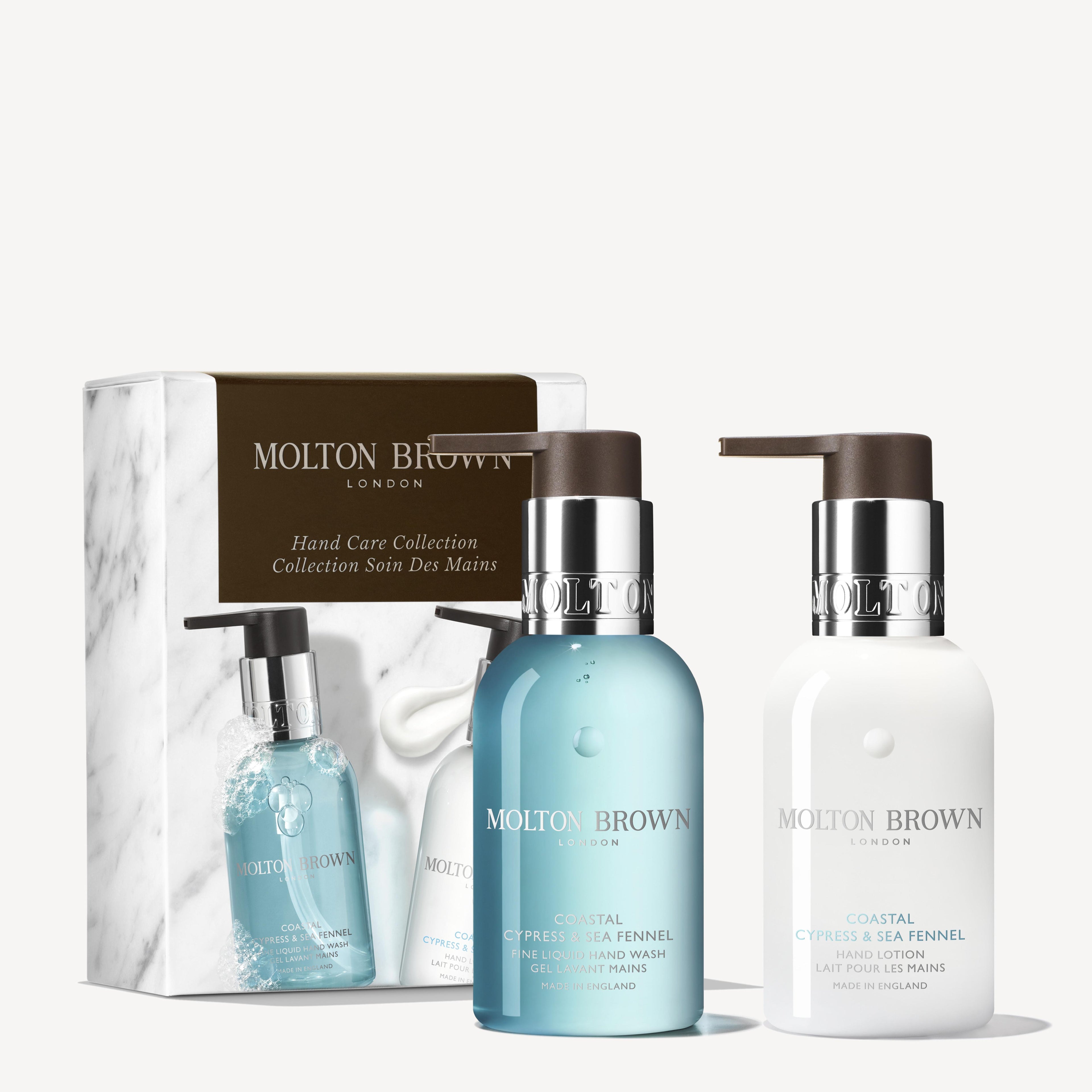 The Coastal Cypress & Sea Fennel Hand Care Collection by MoltonBrown Cyprus includes a hand wash and lotion in stylish pump bottles with blue and white liquids, enhancing the branded box for an opulent presentation.