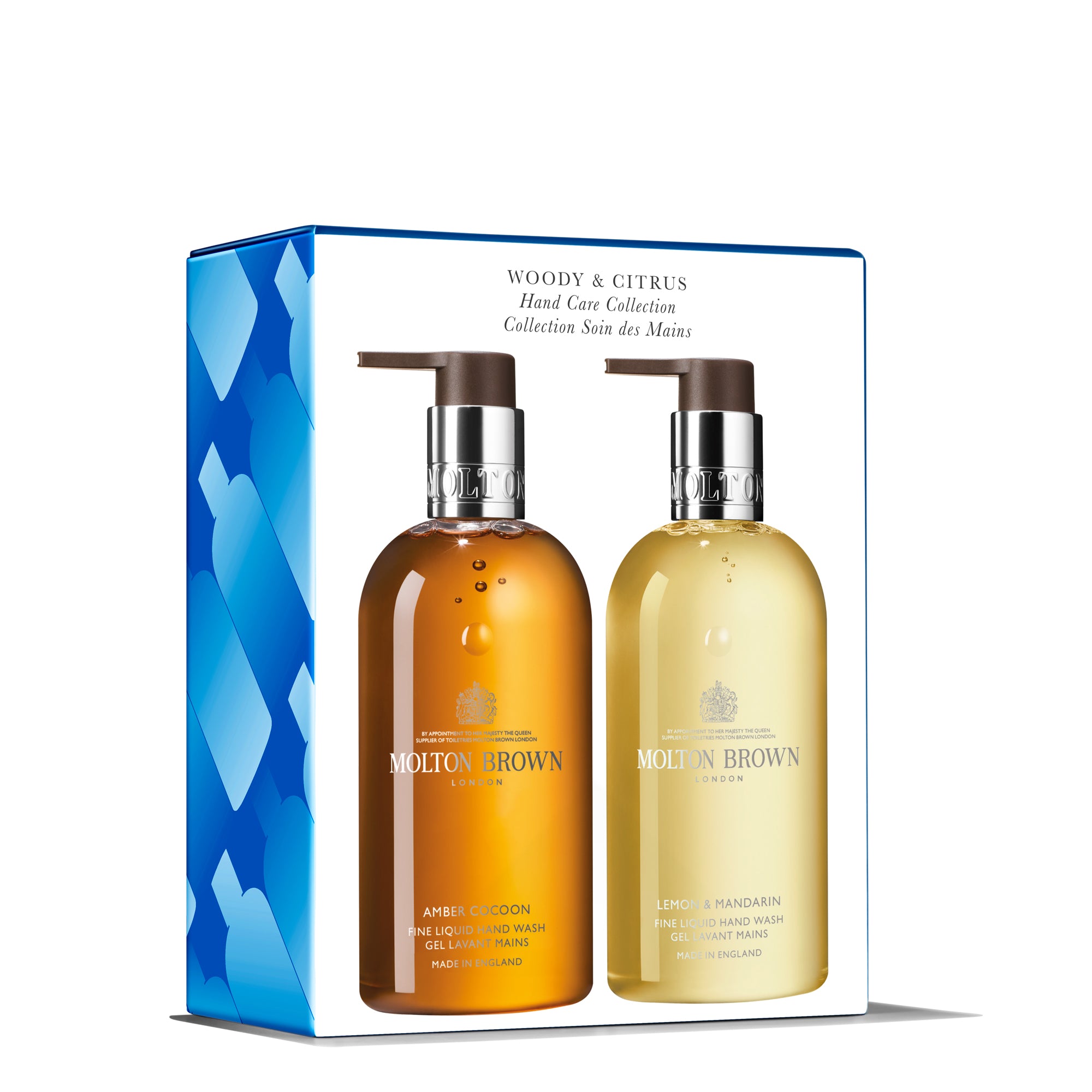 The Woody & Citrus Hand Care Duo by Molton Brown Cyprus includes two aromatic pump bottles, Amber Cocoon and Lemon & Mandarin, packaged in a charming box with a blue heart pattern.