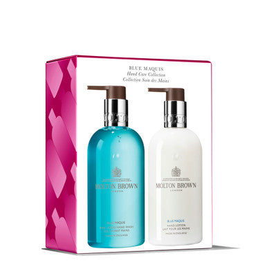 The Blue Maquis Hand Care Collection by MoltonBrown Cyprus is presented as a boxed set, featuring an elegant hand wash and a moisturizing lotion, each conveniently dispensed through pump bottles. The teal hand wash and the white lotion are attractively packaged with a side design of pink and red hearts.