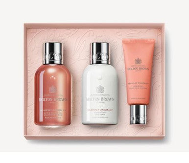 The Heavenly Gingerlily Travel Body & Hand Gift Set by MoltonBrown Cyprus is perfect for a Mother's Day getaway. It includes travel-size essentials: a shower gel, body lotion, and hand cream. These products are packaged in a pink box, with each bottle featuring silver caps and the iconic brand logo, making it ideal for a blooming cleansing ritual.