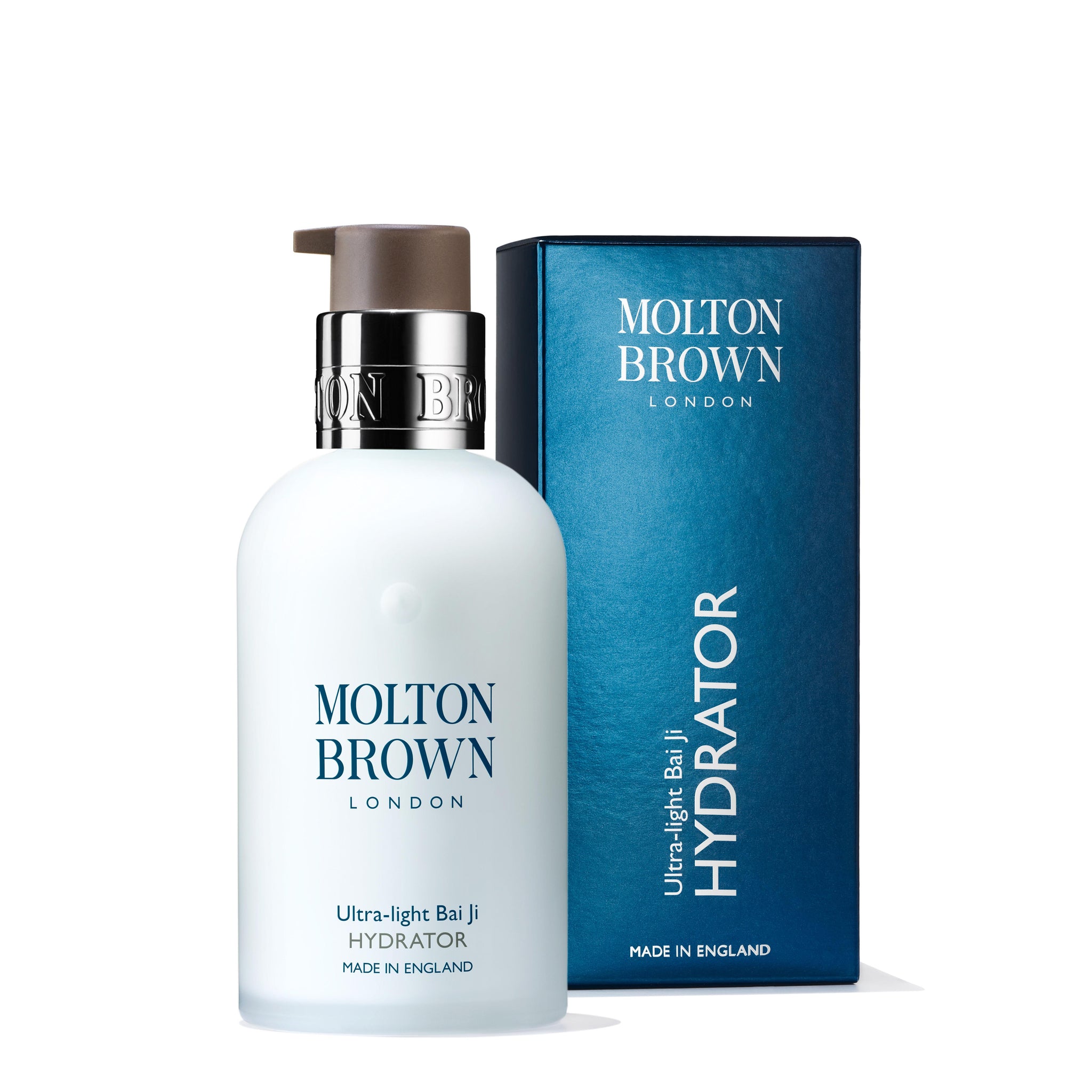 The MoltonBrown Cyprus Ultra-light Bai Ji Hydrator 100ml, enriched with lentil seed extracts, is positioned next to its blue packaging box. This lightweight moisturizer includes a pump dispenser and a metallic silver collar, with the brand name clearly displayed on the front.