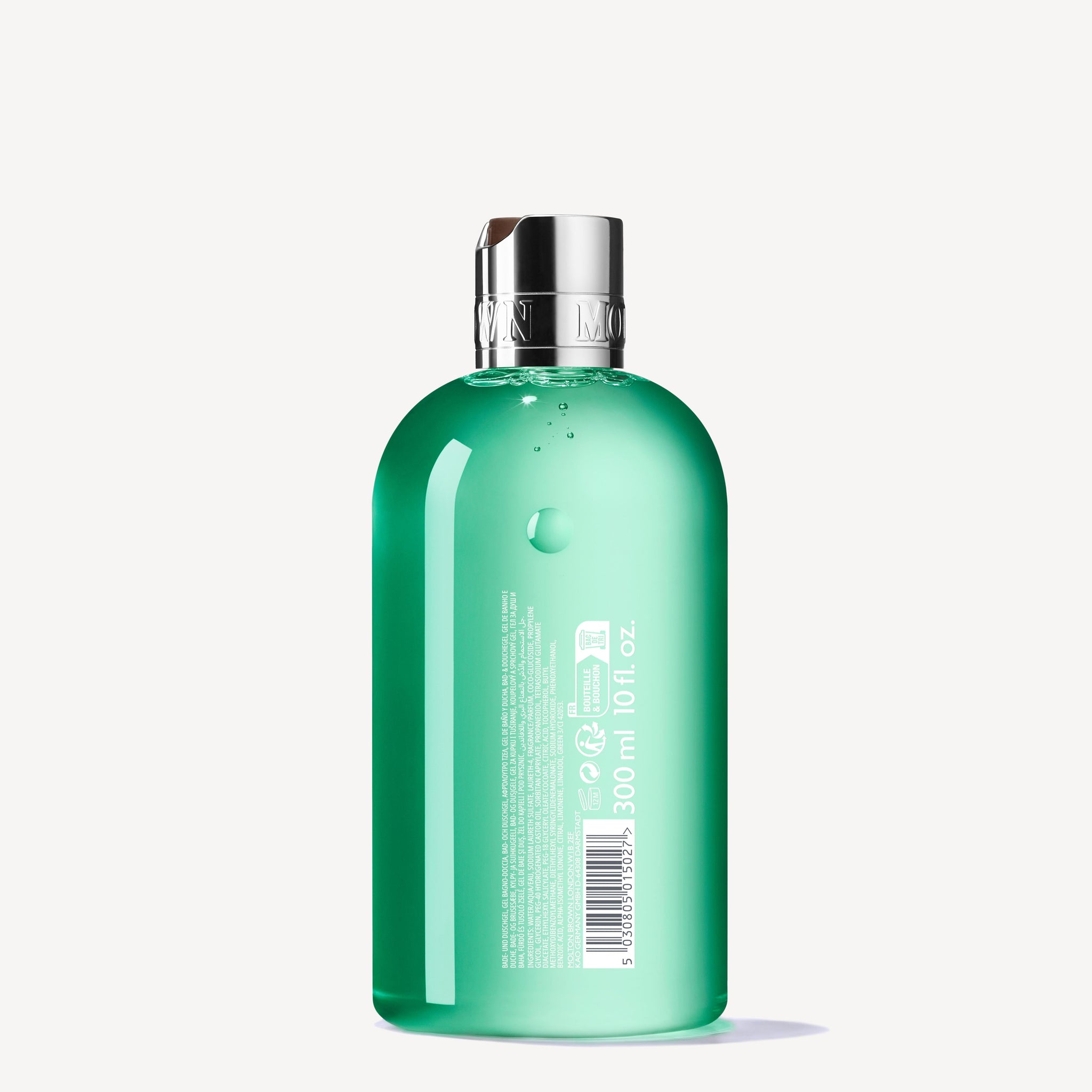 A green translucent bottle of MoltonBrown Cyprus's Wild Mint & Lavandin Bath & Shower Gel, featuring a silver cap and labeled with product details, contains 300 ml (10 fl. oz.) of refreshing gel.