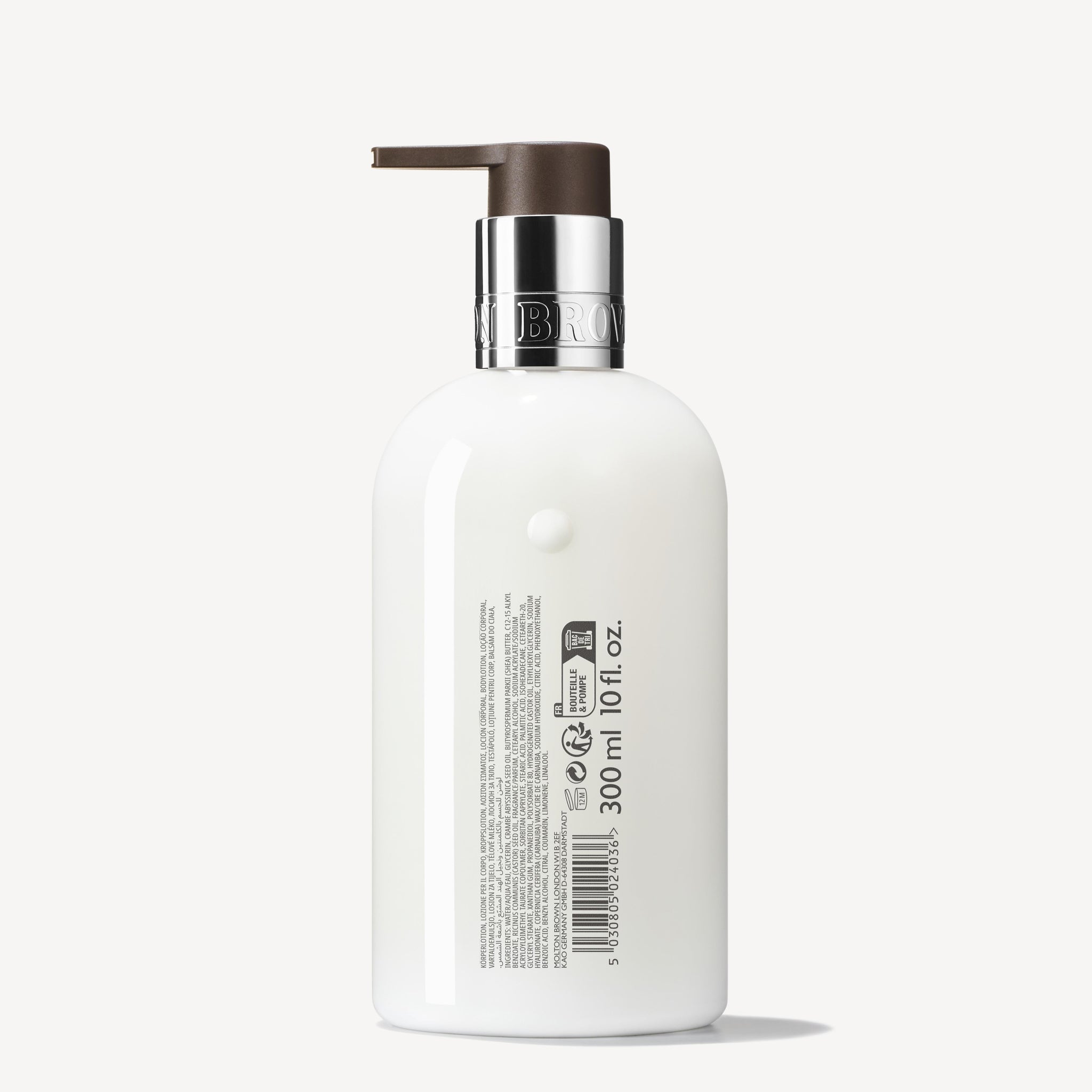 The MoltonBrown Cyprus Sunlit Clementine & Vetiver Body Lotion 300ml comes in a white pump bottle with a silver and brown cap. Its back label is adorned with text, symbols, and a barcode, providing intricate details to the invigorating blend infused with the scent of clementine zest.