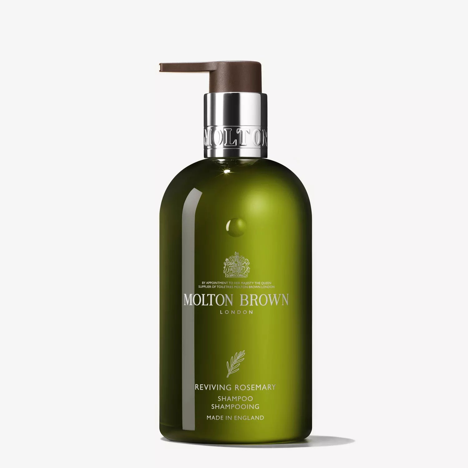 A 300ml green bottle of Molton Brown Cyprus Reviving Rosemary Shampoo with a silver and brown pump dispenser. Made in England, this rosemary-infused shampoo promises healthier hair with every use.