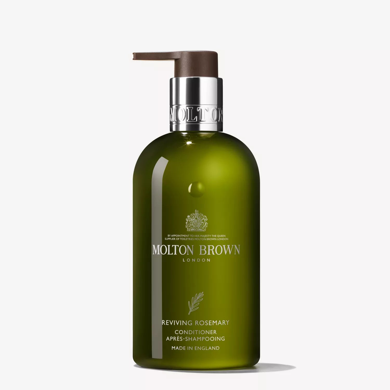 The 300ml green Molton Brown Cyprus Reviving Rosemary Conditioner features a pump dispenser and labeled brand details, highlighting its English roots. This nature-inspired conditioner provides a moisturized, silky feel, perfect for rosemary shampoo routines.