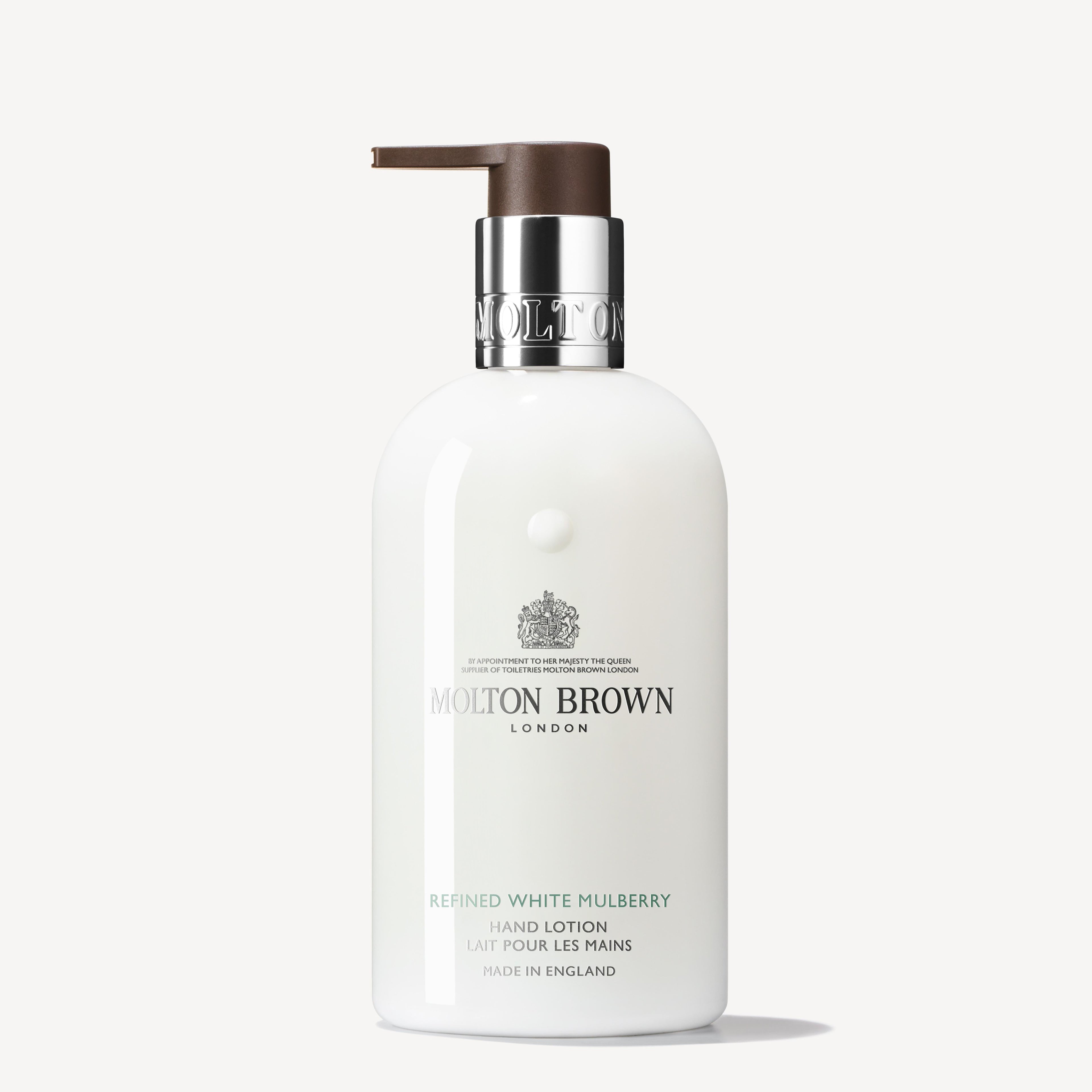 A 300ml bottle of MoltonBrown Cyprus Refined White Mulberry Fine Liquid Hand Lotion, equipped with a pump dispenser and infused with clary sage. The label indicates "Made in England" and showcases elegant brown and black text on the white bottle.