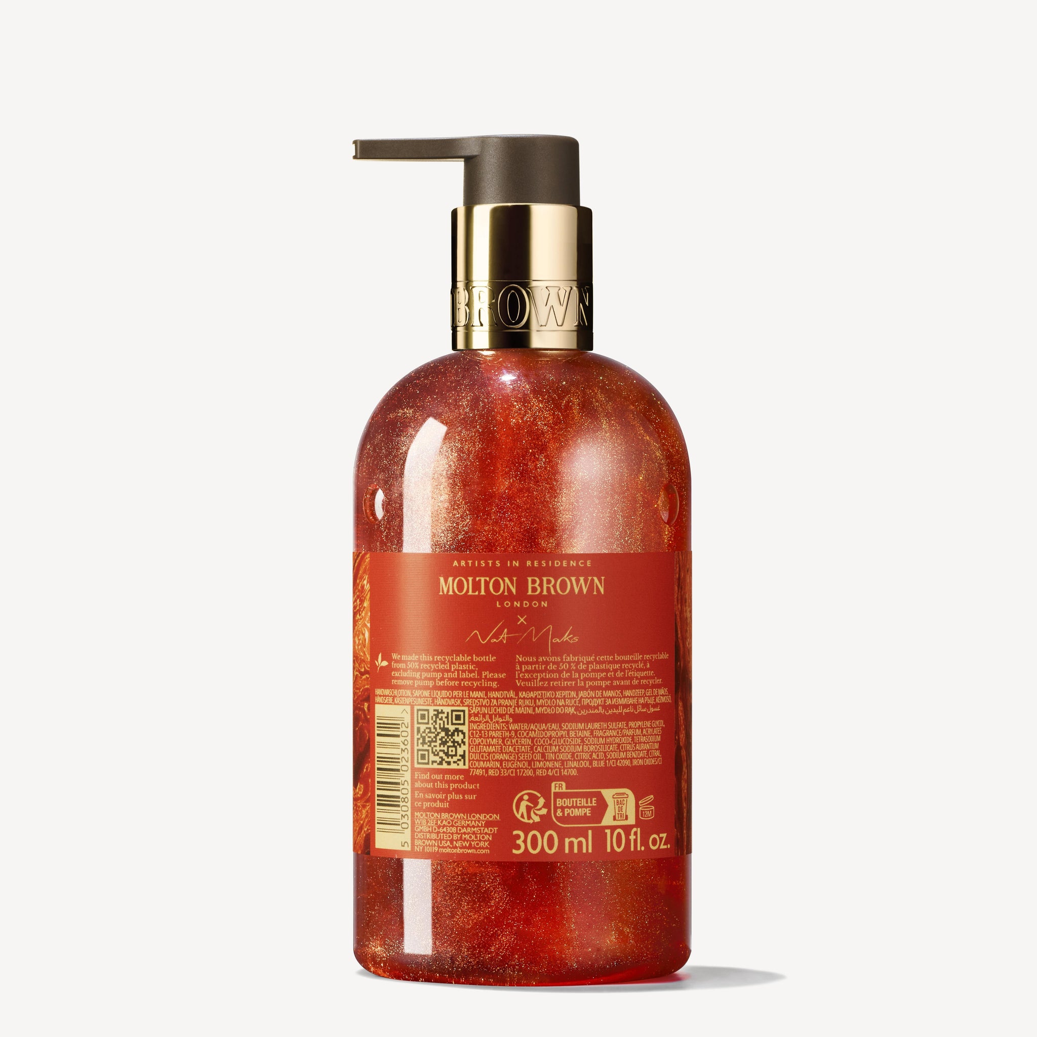 A bottle of MoltonBrown Cyprus Marvellous Mandarin & Spice Fine Liquid Hand Wash with a pump dispenser. The translucent bottle reveals a reddish-orange liquid, reminiscent of juicy mandarin, and features a label displaying the brand name and product details. The capacity is 300 ml or 10 fl oz.