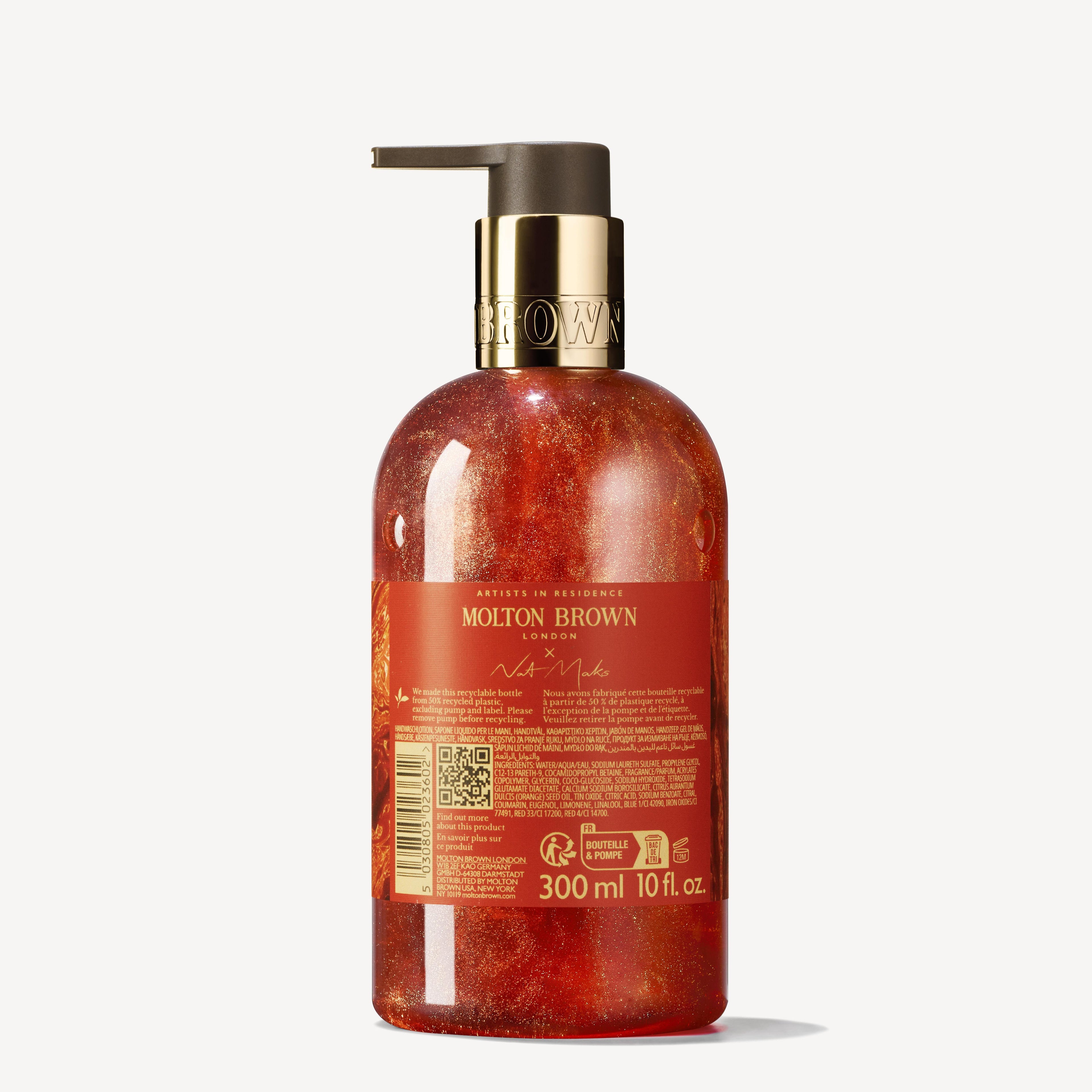 A bottle of MoltonBrown Cyprus Marvellous Mandarin & Spice Fine Liquid Hand Wash with a pump dispenser. The translucent bottle reveals a reddish-orange liquid, reminiscent of juicy mandarin, and features a label displaying the brand name and product details. The capacity is 300 ml or 10 fl oz.