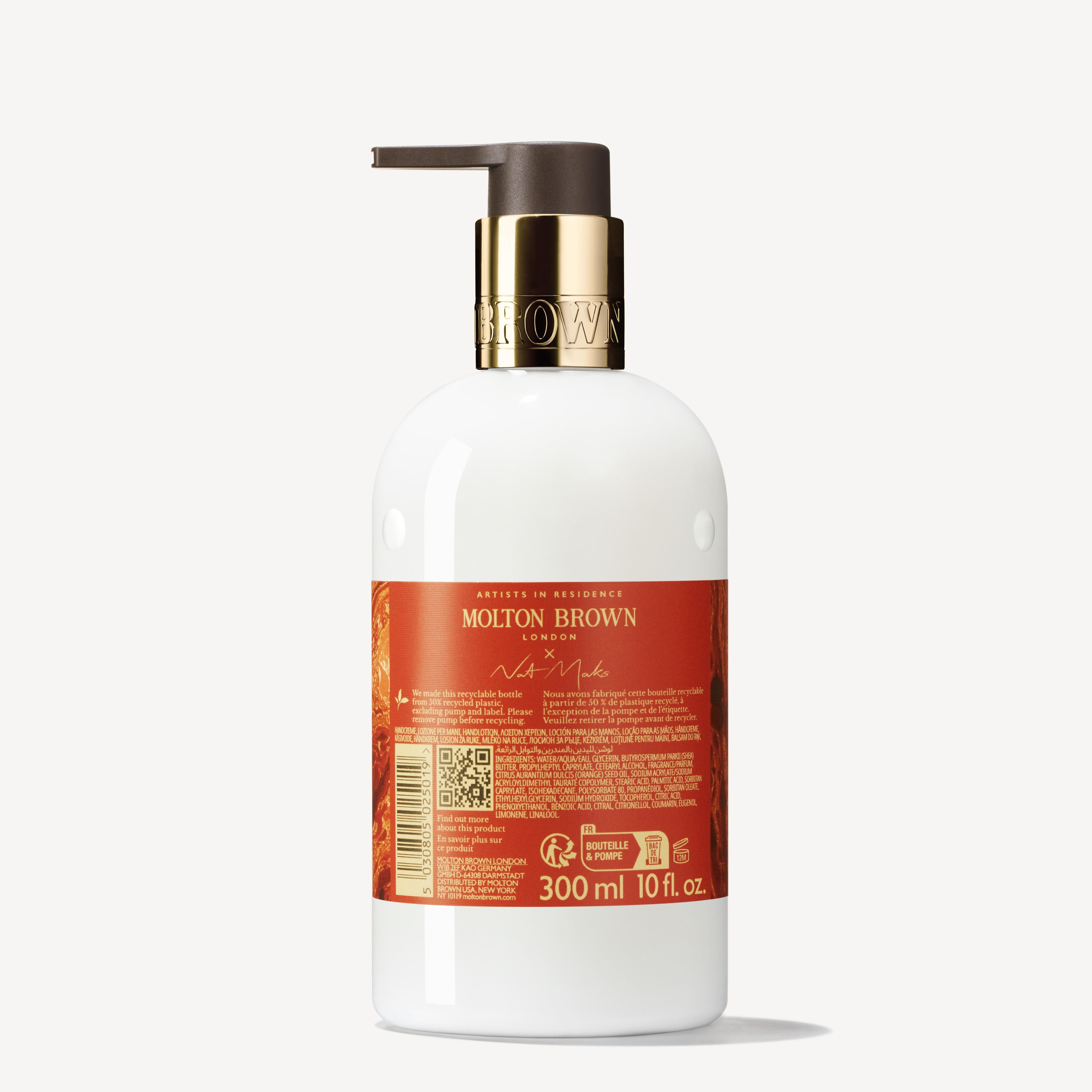 A white bottle of MoltonBrown Cyprus Marvellous Mandarin & Spice Hand Lotion features a black pump and a red label with gold text. Infused with zesty mandarin essence, the 300 ml (10 fl. oz.) bottle is elegantly crafted, displaying branding and product information on the label.