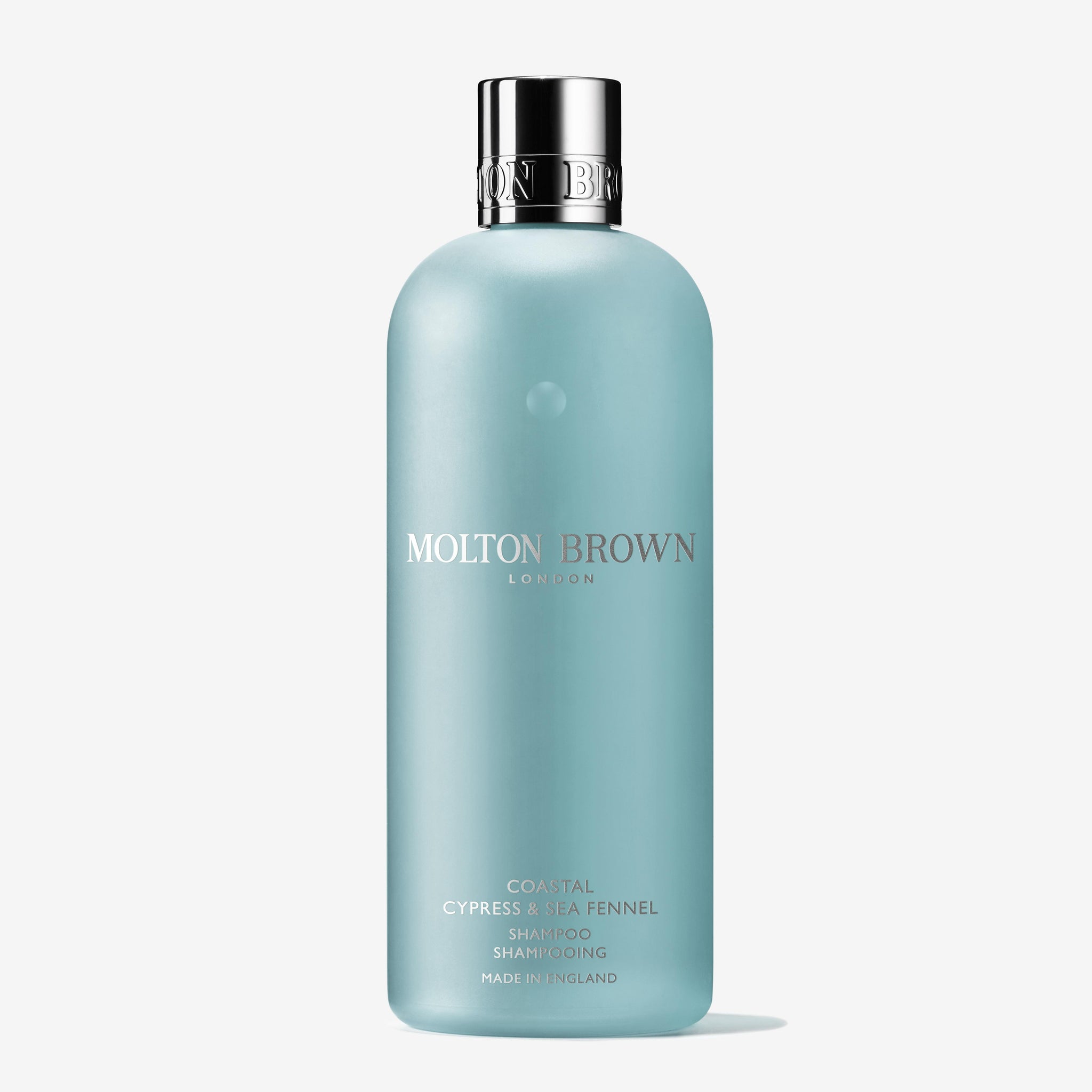 A light blue 300ml bottle of MoltonBrown Cyprus Coastal Cypress & Sea Fennel Shampoo features marine notes, a chrome cap, and minimalist white front text.