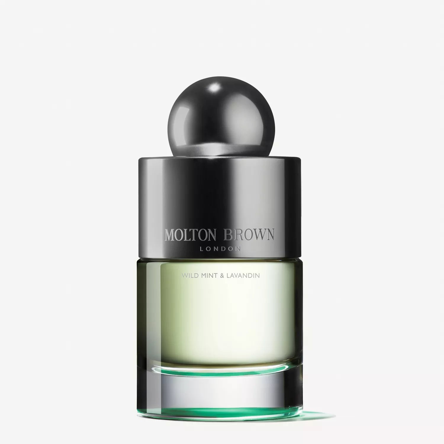 A 100ml bottle of Wild Mint & Lavandin Eau de Toilette from MoltonBrown Cyprus. It has a shiny spherical cap with a clear-to-pale-green gradient base, capturing the essence of wild mint against a plain white background.