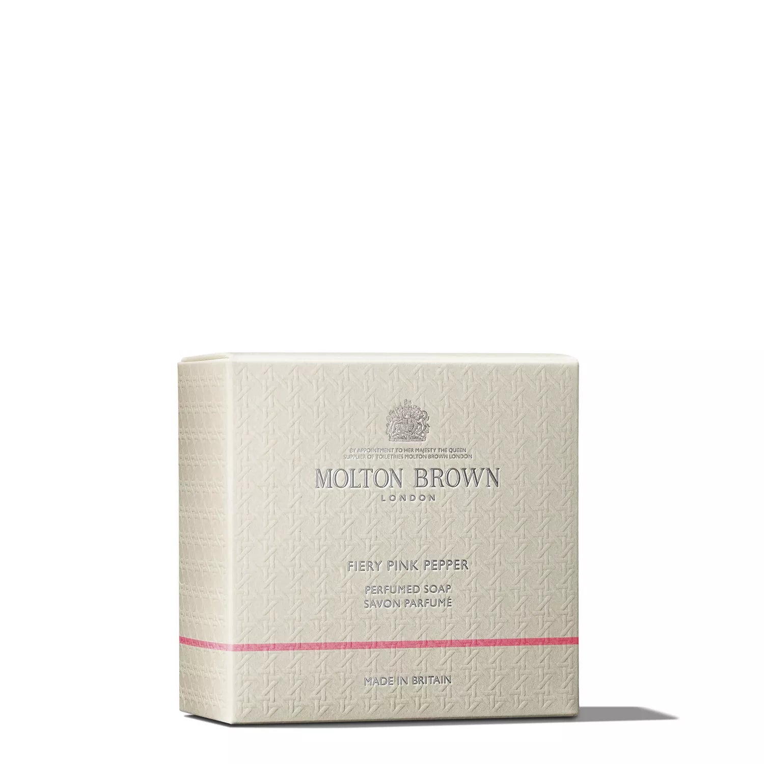 A beige box of MoltonBrown Cyprus's Fiery Pink Pepper Perfumed Soap 150g, enriched with shea butter, is showcased against a white background. The packaging features a delicate texture with a small pink stripe near the bottom, beautifully embodying the essence of this woody-spicy soap.