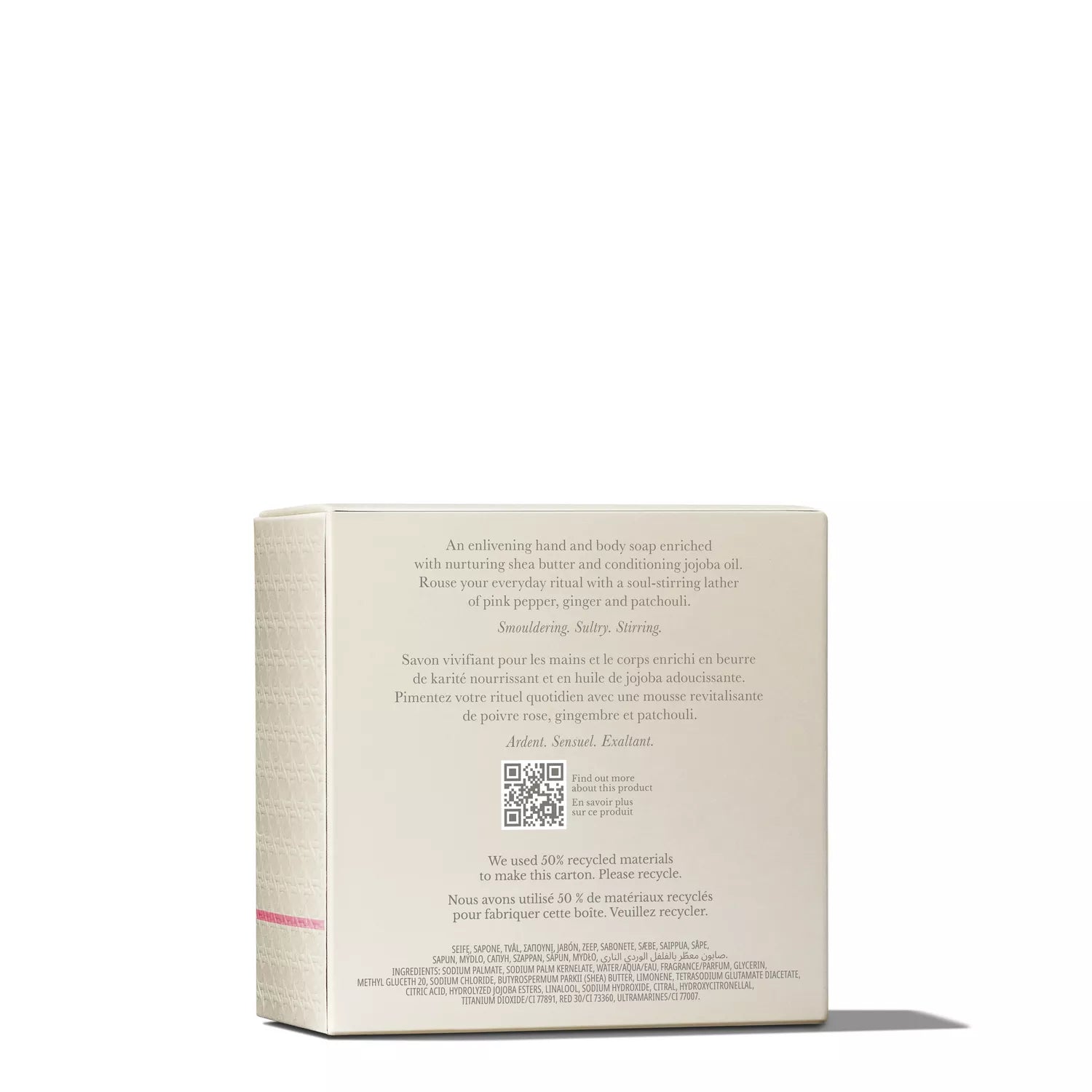 A box of MoltonBrown Cyprus' Fiery Pink Pepper Perfumed Soap 150g with a pale color rests on a flat surface. The text emphasizes ingredients such as black pepper, ginger, and patchouli, complemented by hints of pink pepper. A QR code is visible on the packaging.