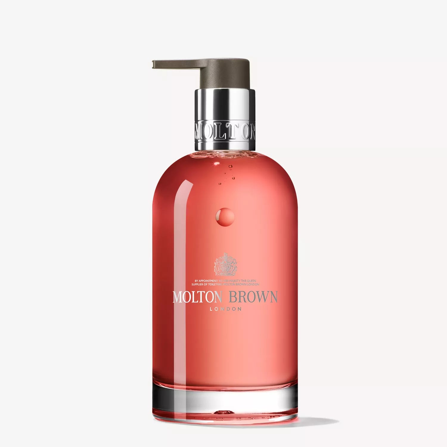 A clear glass bottle with a pump dispenser contains Heavenly Gingerlily Fine Liquid Hand Wash by Molton Brown Cyprus. Its elegant design and subtle branding on a white background make it ideal for your sustainable ritual.