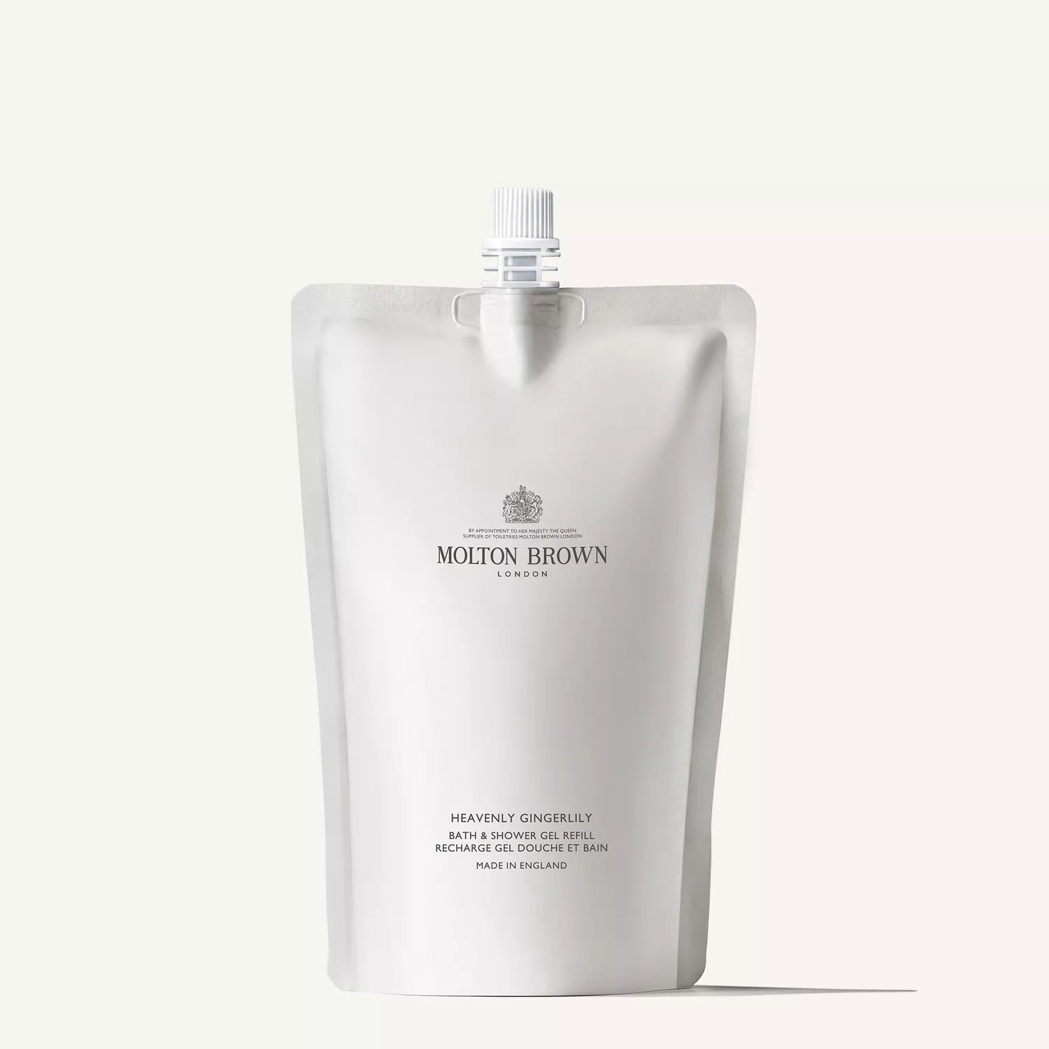 The 400ml Molton Brown Cyprus Heavenly Gingerlily Bath & Shower Gel Refill, featuring a top spout, is a sustainable choice. With its elegantly displayed logo and product info in sophisticated typography, its perfect for effortlessly maintaining your favorite body wash.