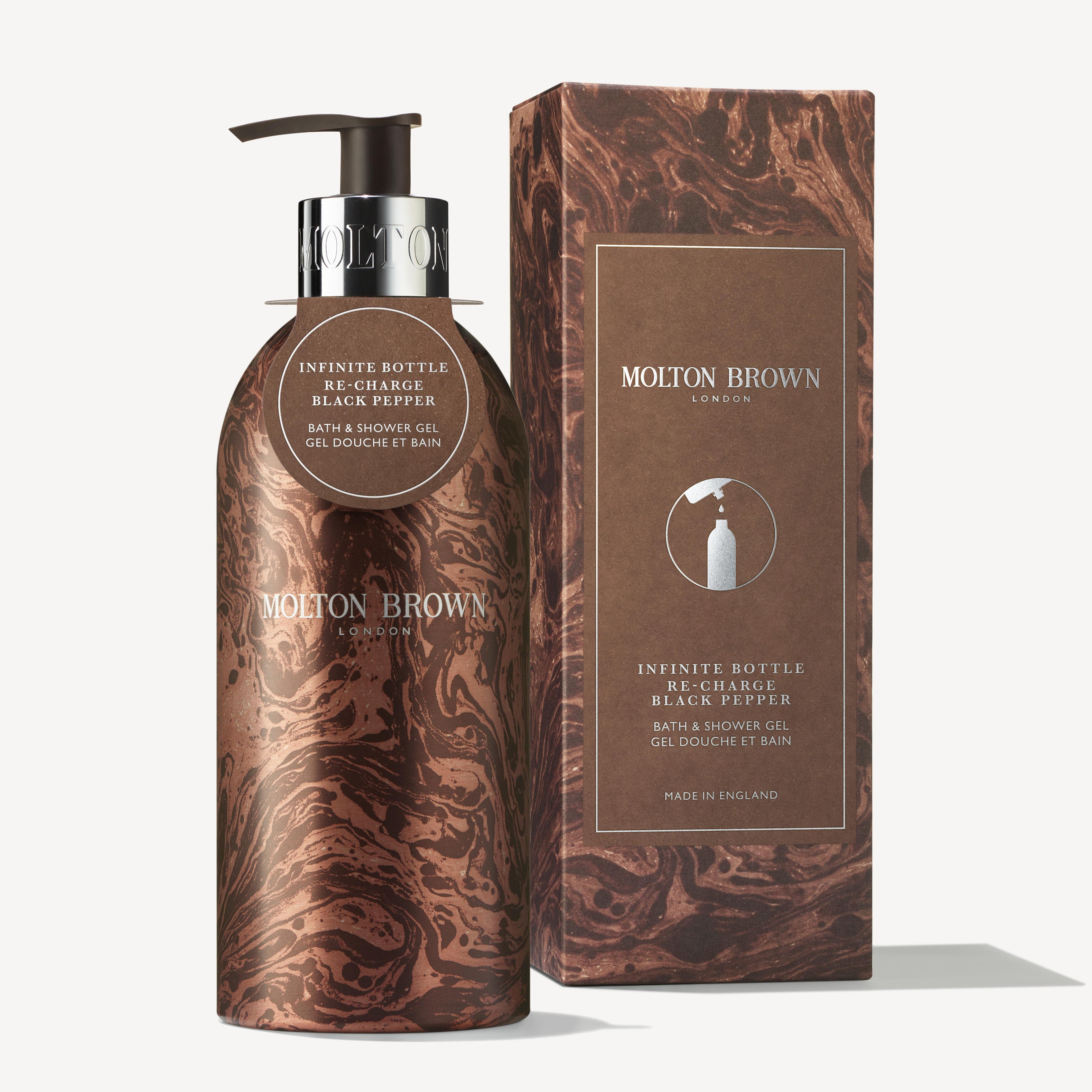 Introducing the Limited Edition Re-charge Black Pepper Infinite Bottle by MoltonBrown Cyprus, a refillable shower gel that combines a woody-citrus fragrance with luxury. Elegantly packaged in a matching box, this bottle showcases a marbled brown design and includes a convenient pump dispenser. Proudly labeled Made in England, it offers an eco-friendly approach to indulgence.