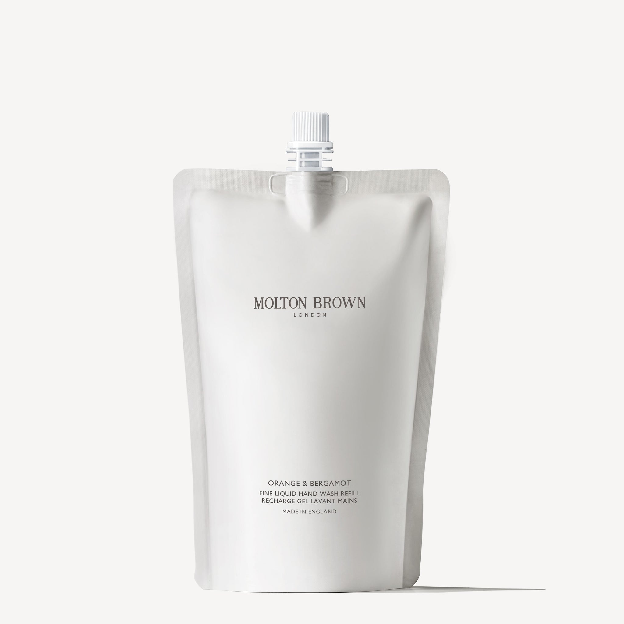 Experience the eco-friendly Orange & Bergamot Fine Liquid Hand Wash Refill 400ml from MoltonBrown Cyprus. Its minimalist design includes a practical spout, complemented by sleek, predominantly white packaging with silver accents for an elegant touch to your sustainable choice.