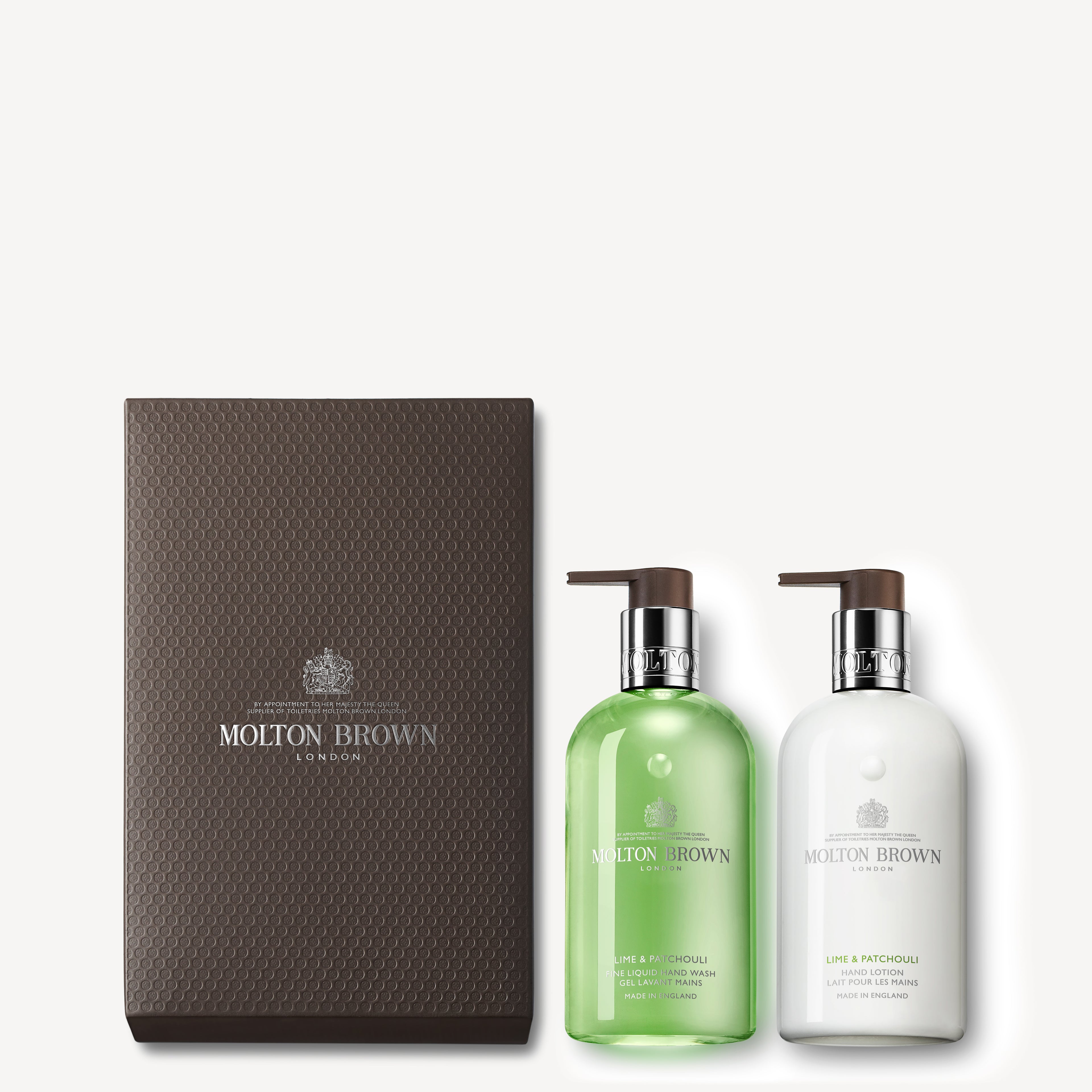 The Lime & Patchouli Hand Wash & Lotion Set by MoltonBrown Cyprus is presented in a dark textured box and includes a green bath and shower gel, as well as a white body lotion. Both items feature the invigorating essence of Thai lime leaves and are equipped with pump dispensers for ease of use.