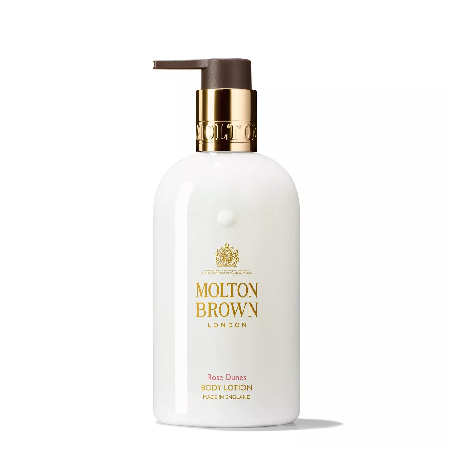 A white bottle from the Molton Brown Cyprus Rose Dunes Body Care Gift Set features a gold pump and label detailing. Infused with patchouli Sulawesis rich aroma, this luxurious English-made lotion is perfect for pampering.