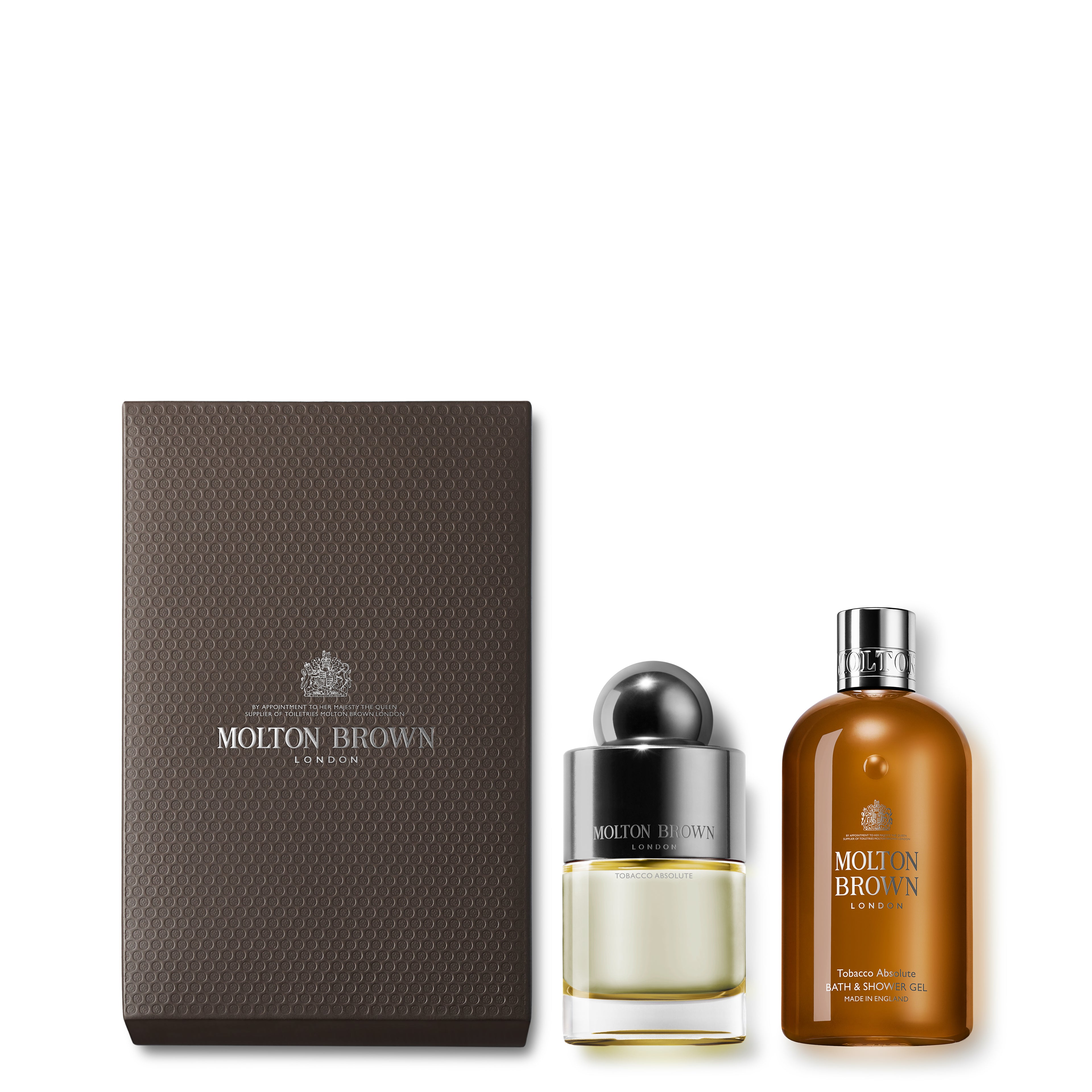 The 100ml Tobacco Absolute Fragrance Gift Set from MoltonBrown Cyprus features a bottle of Eau de Toilette with a round silver cap and a luxurious body wash, all elegantly presented in a black textured box. The products are showcased against a white background, exuding sophistication and elegance.